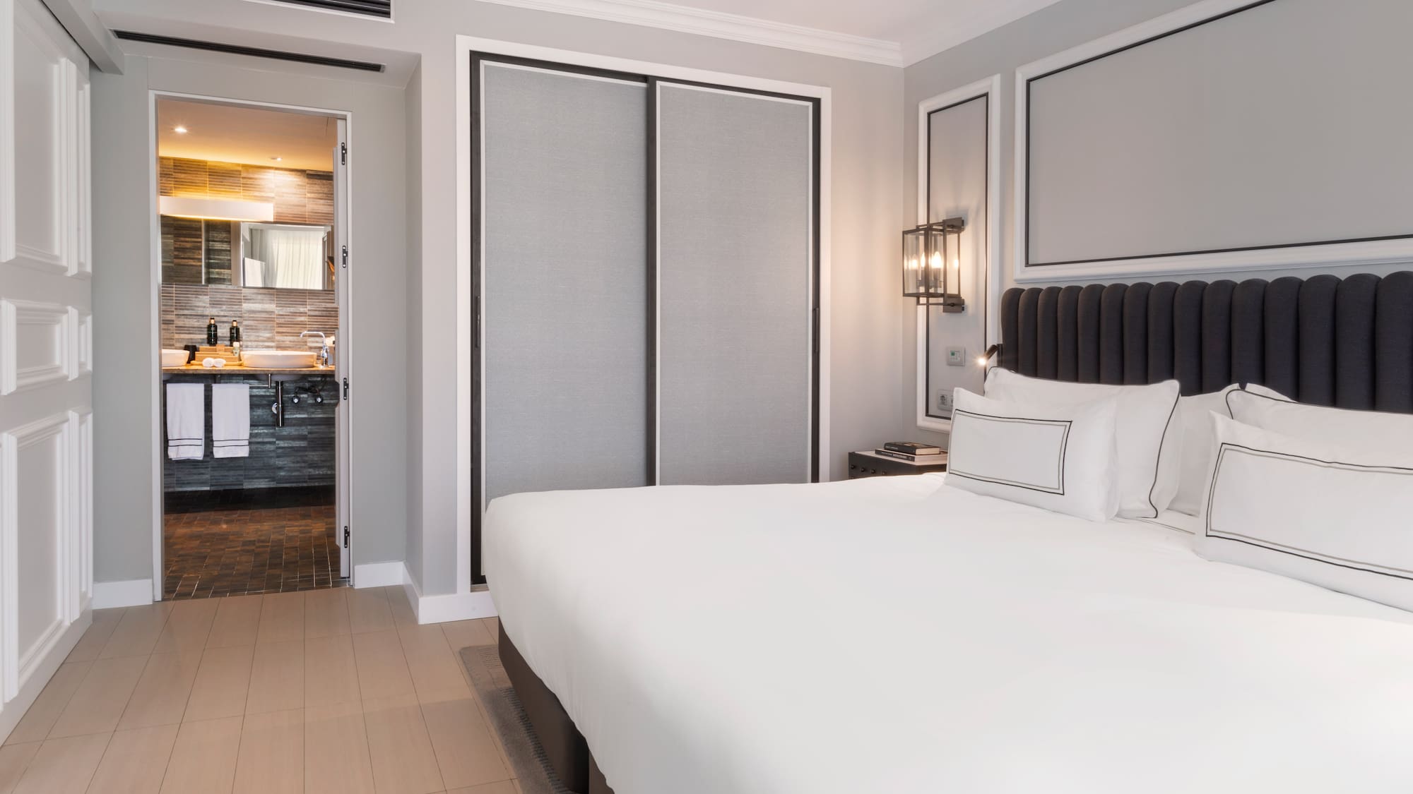 a bedroom with a bed and a closet door