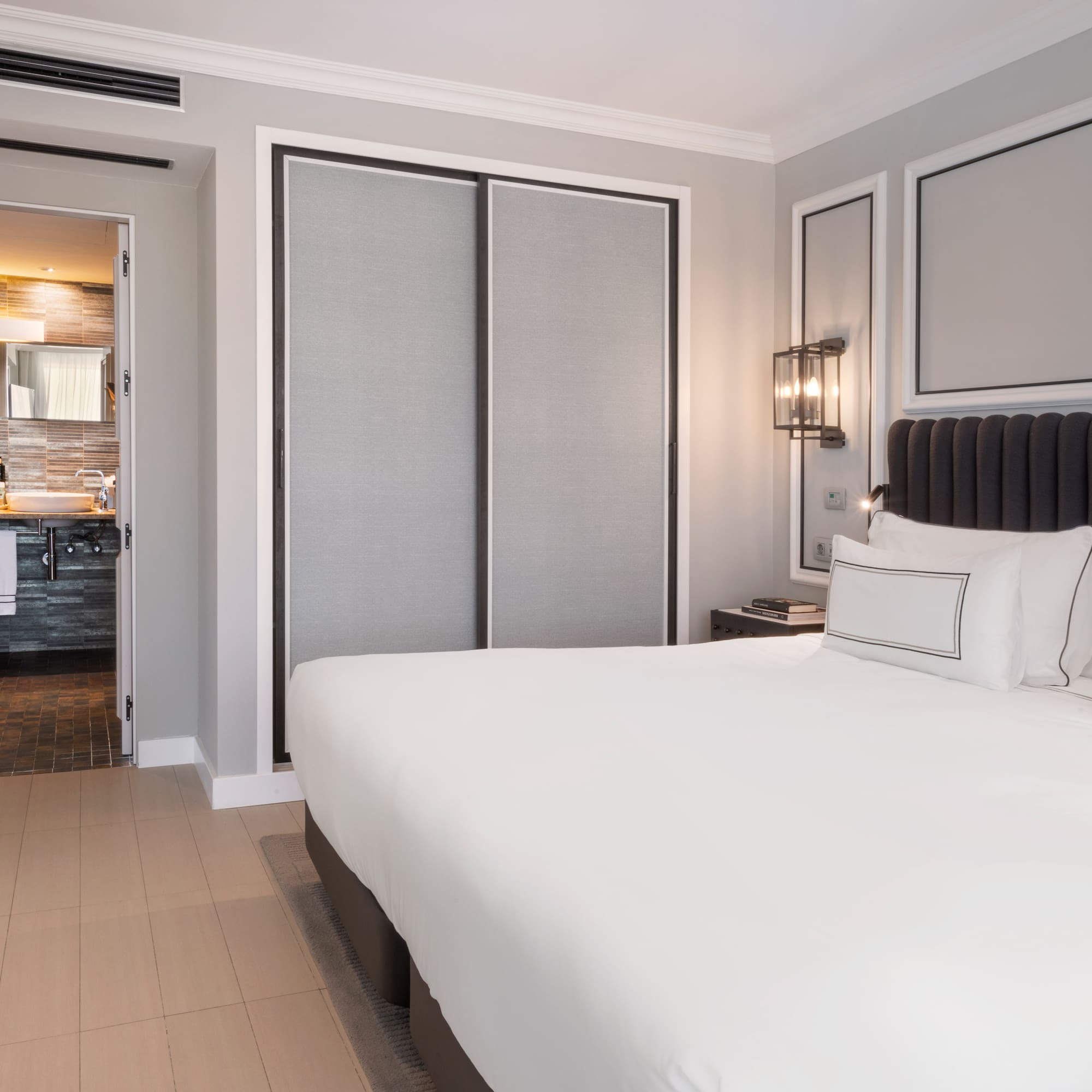 a bedroom with a bed and a closet door