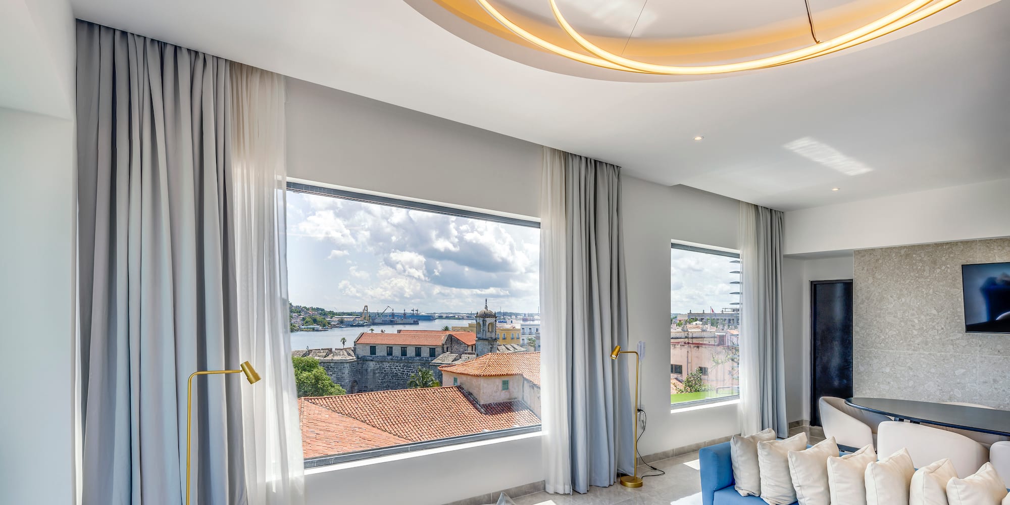 a room with a couch and a large window