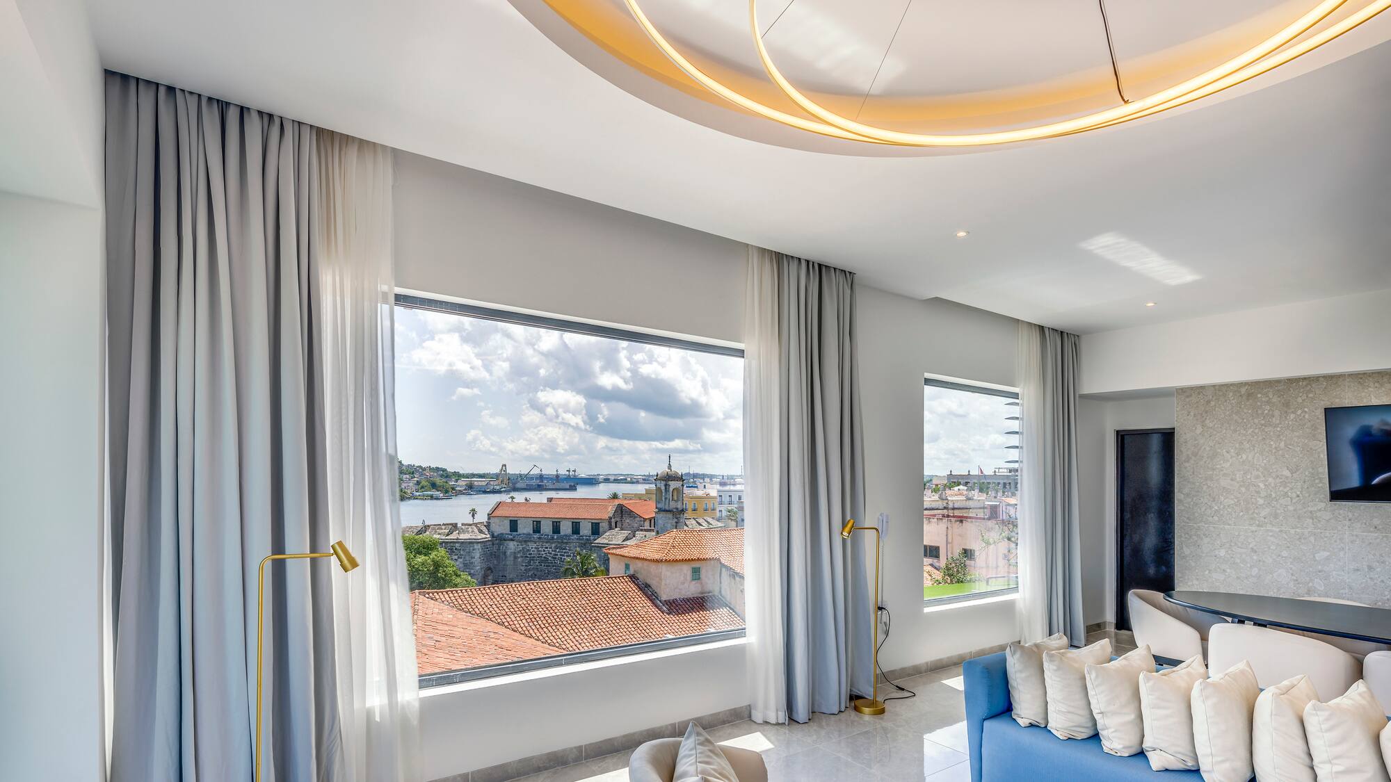 a room with a couch and a large window