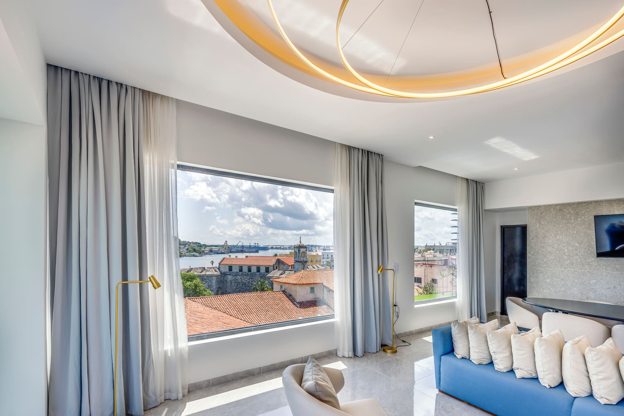 a room with a couch and a large window