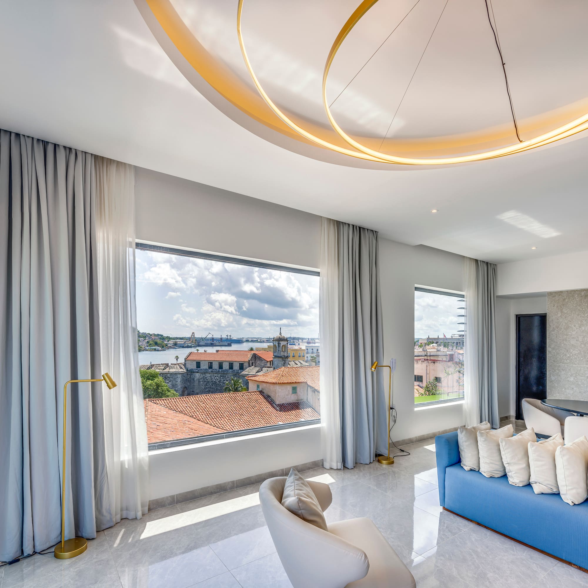 a room with a couch and a large window