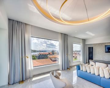 a room with a couch and a large window