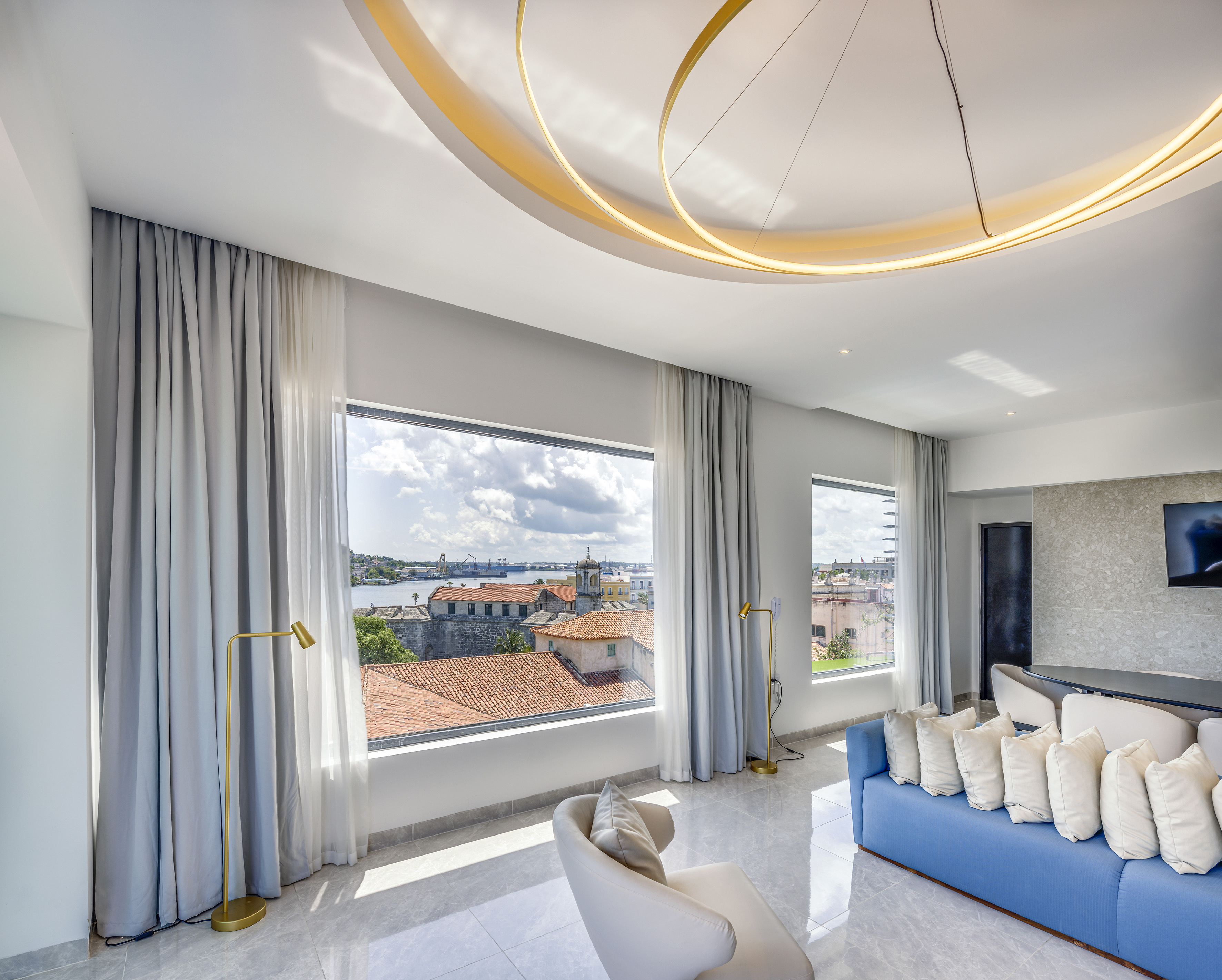 a room with a couch and a large window