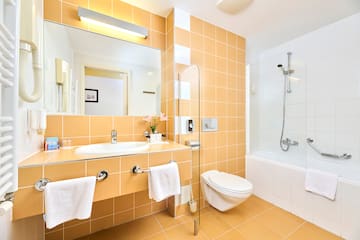 a bathroom with a shower and sink