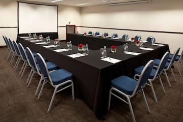 a long conference room with chairs and tables