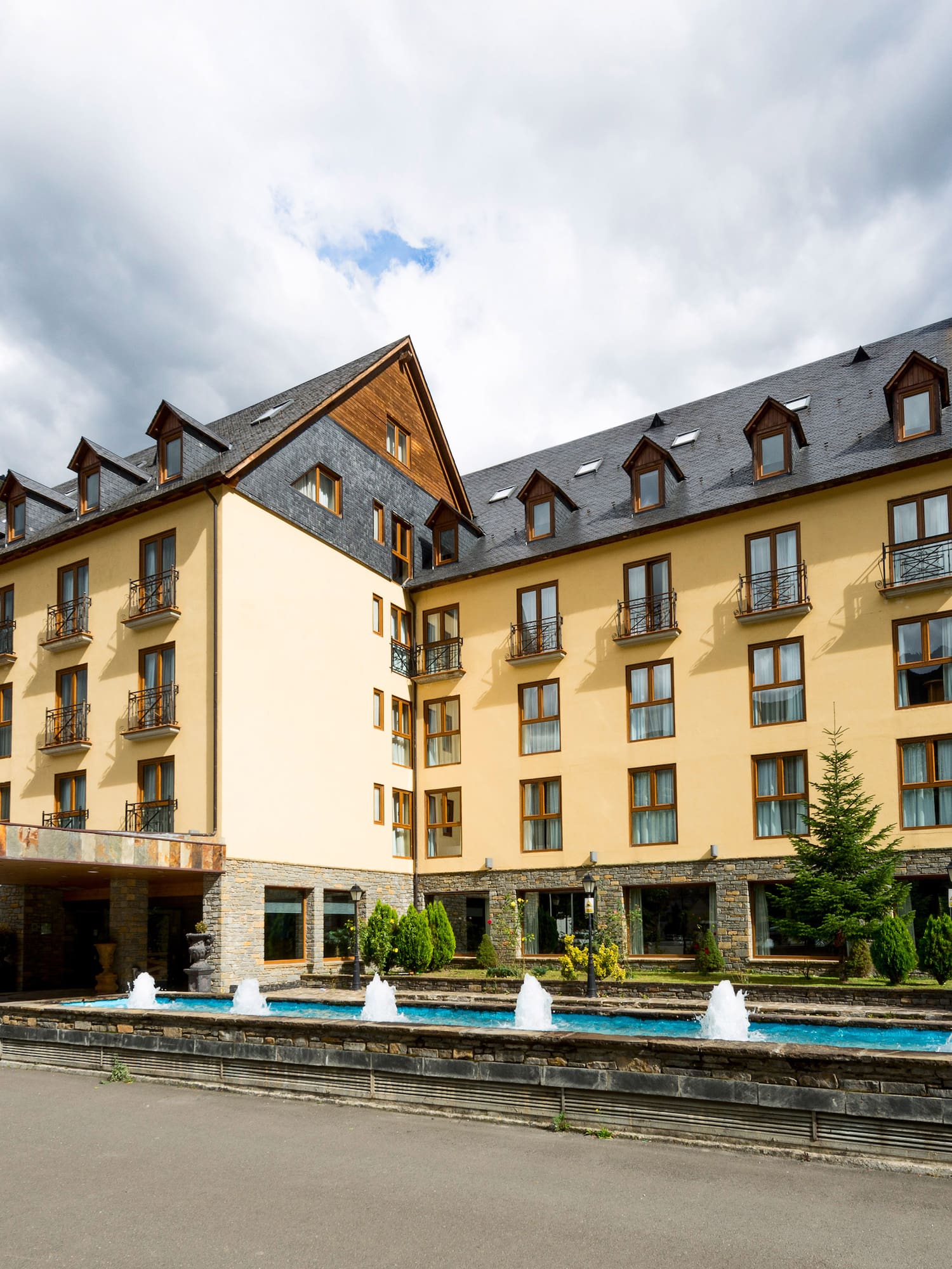 a building with a fountain in front of it