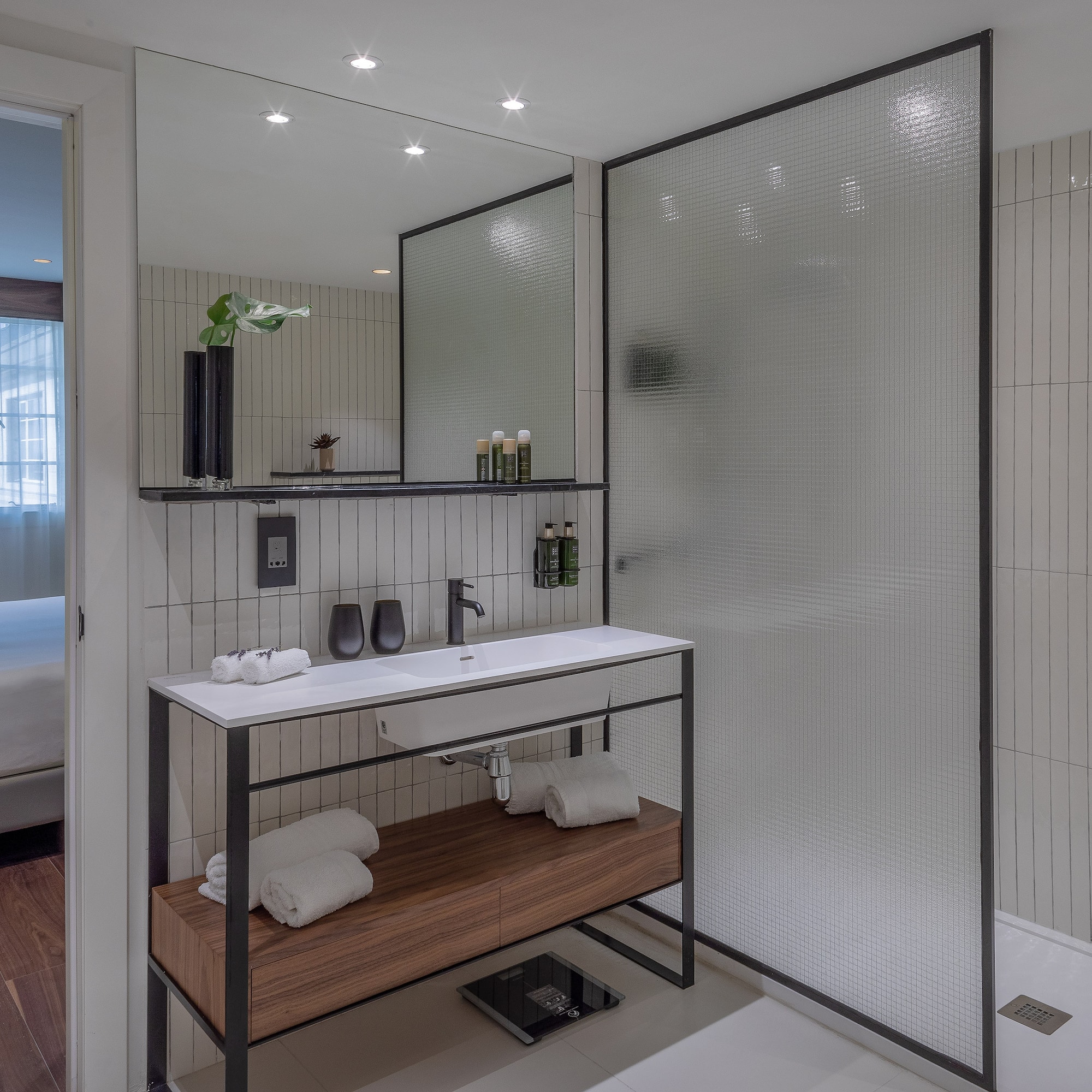 a bathroom with a shower and a sink