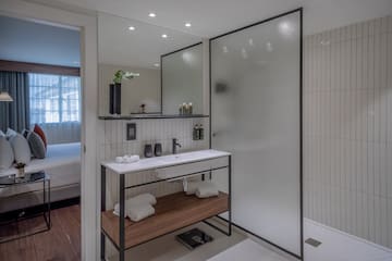 a bathroom with a shower and a sink