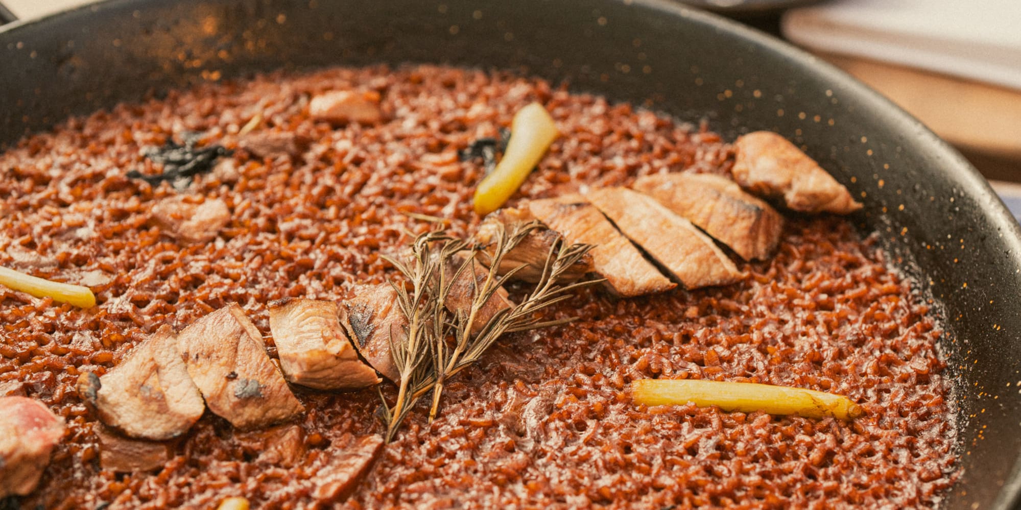 a pan of food with meat and vegetables