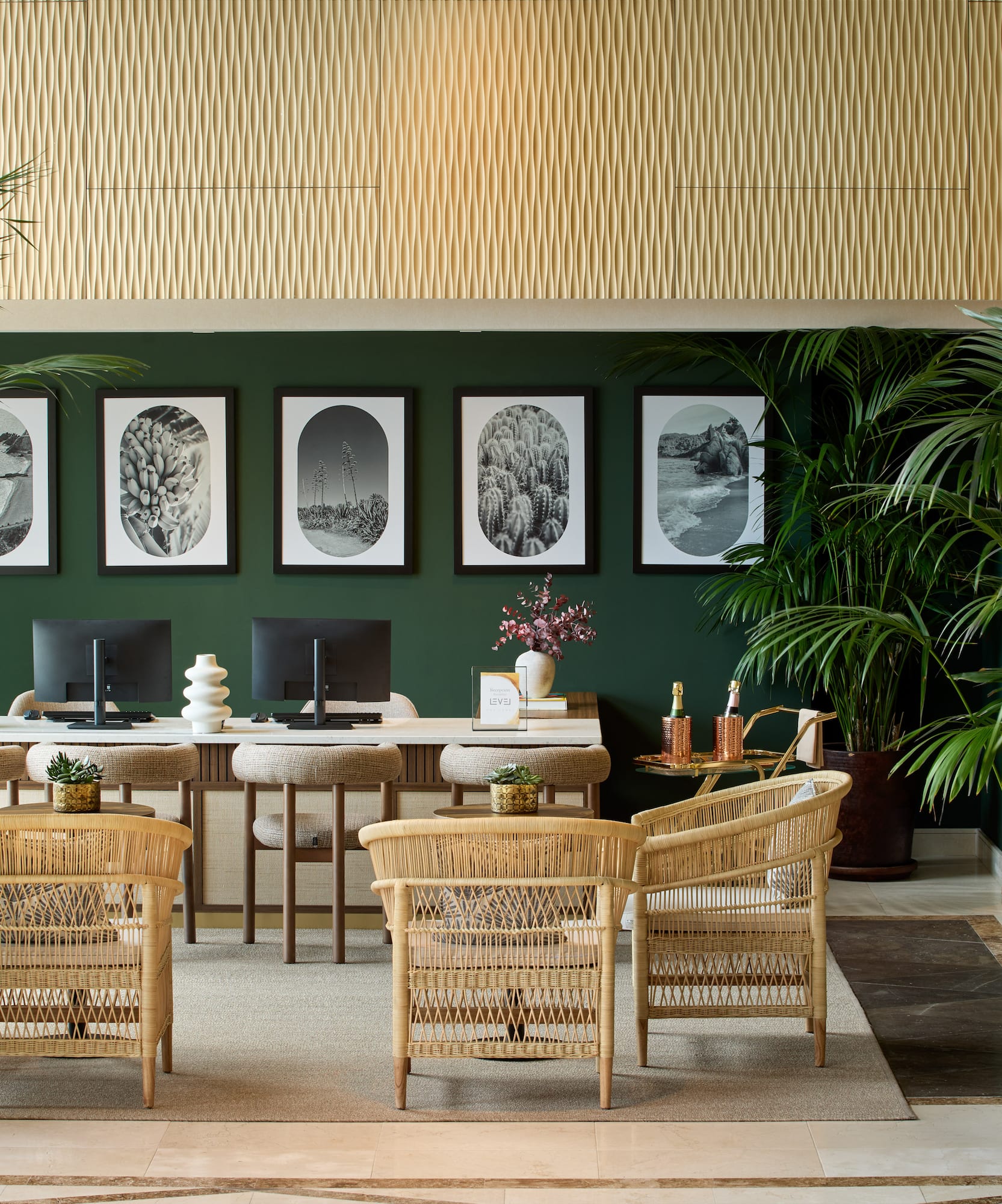 a room with a desk and chairs and a computer