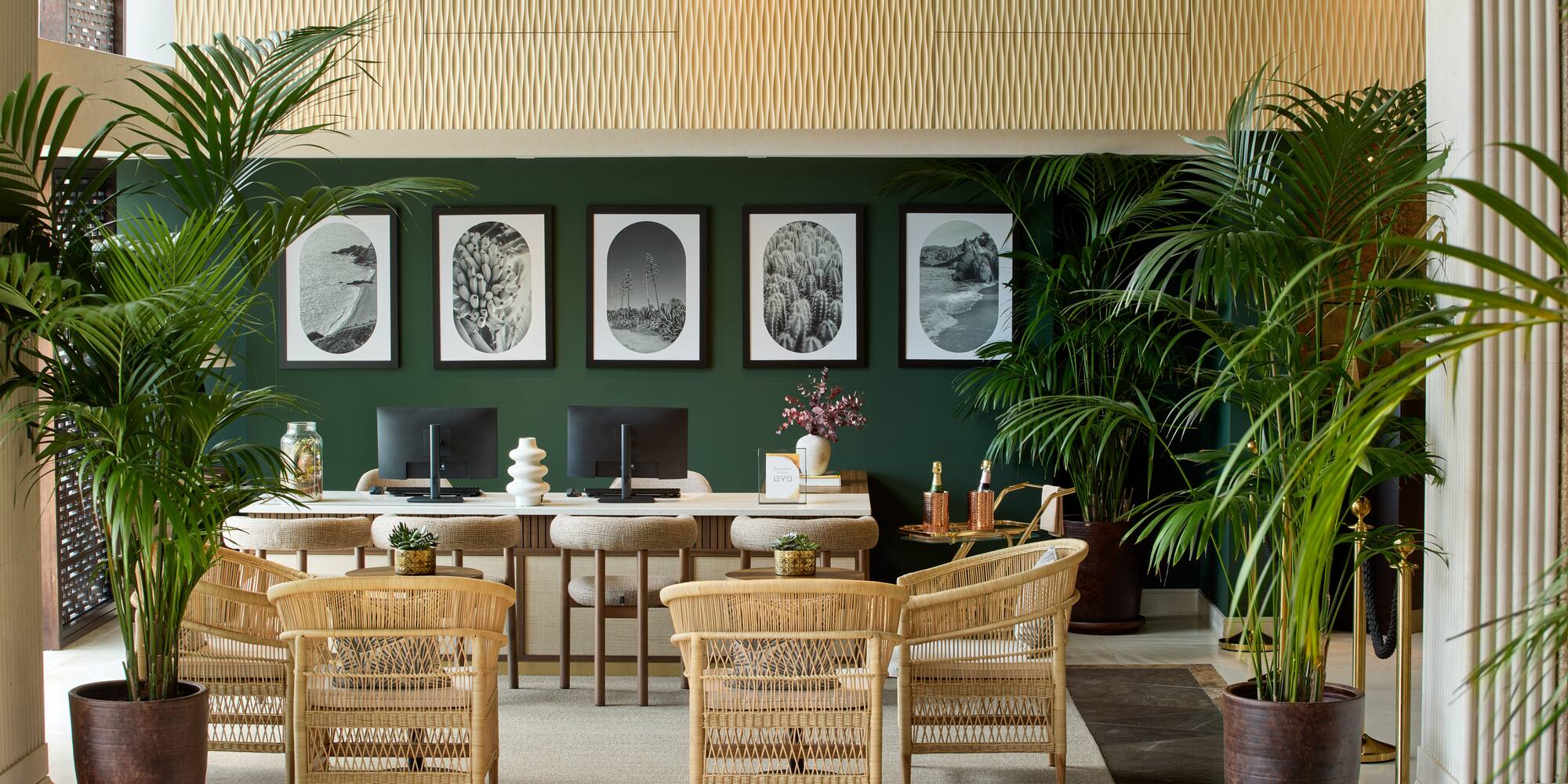 a room with a desk and chairs and a computer