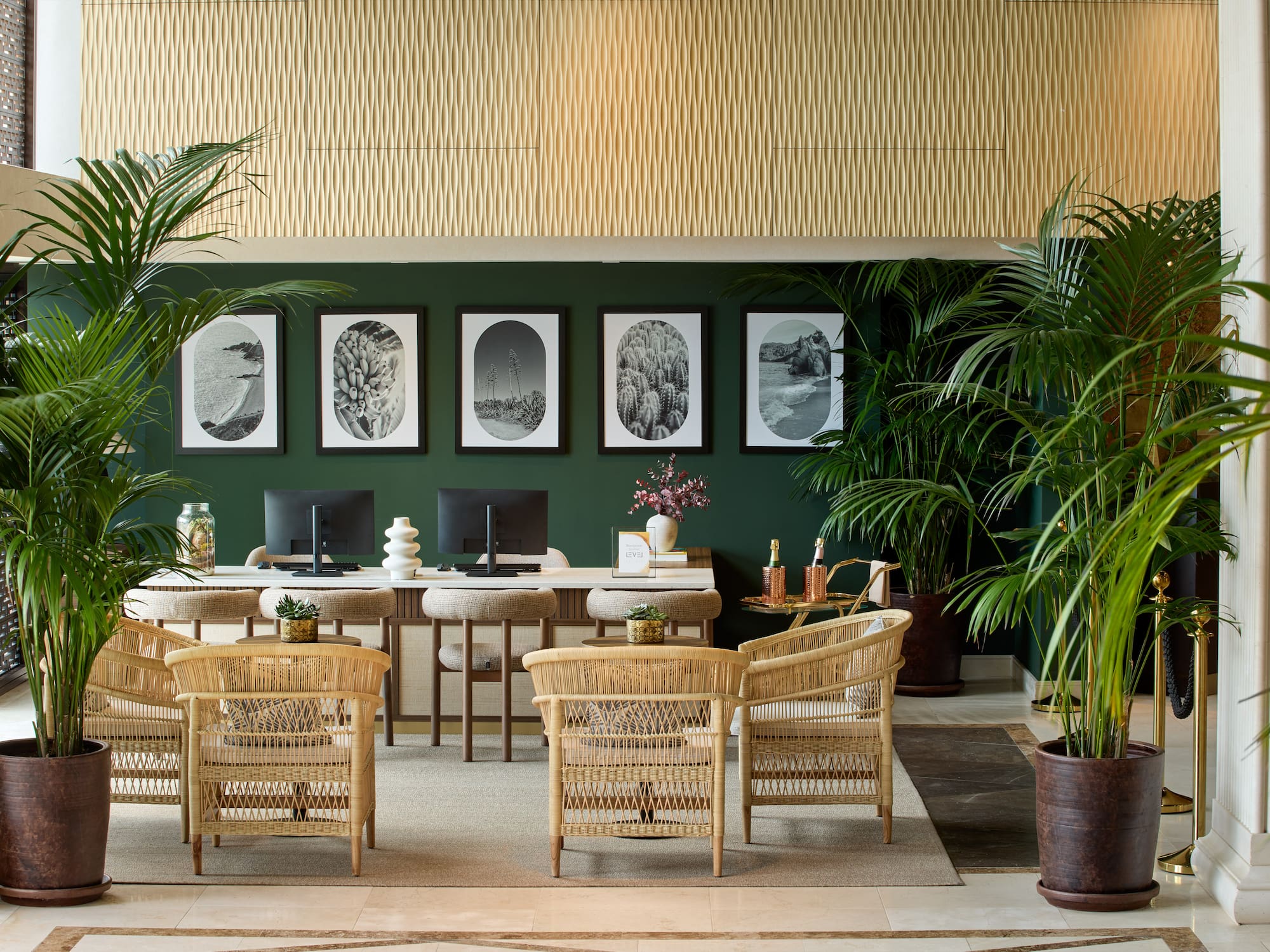 a room with a desk and chairs and a computer