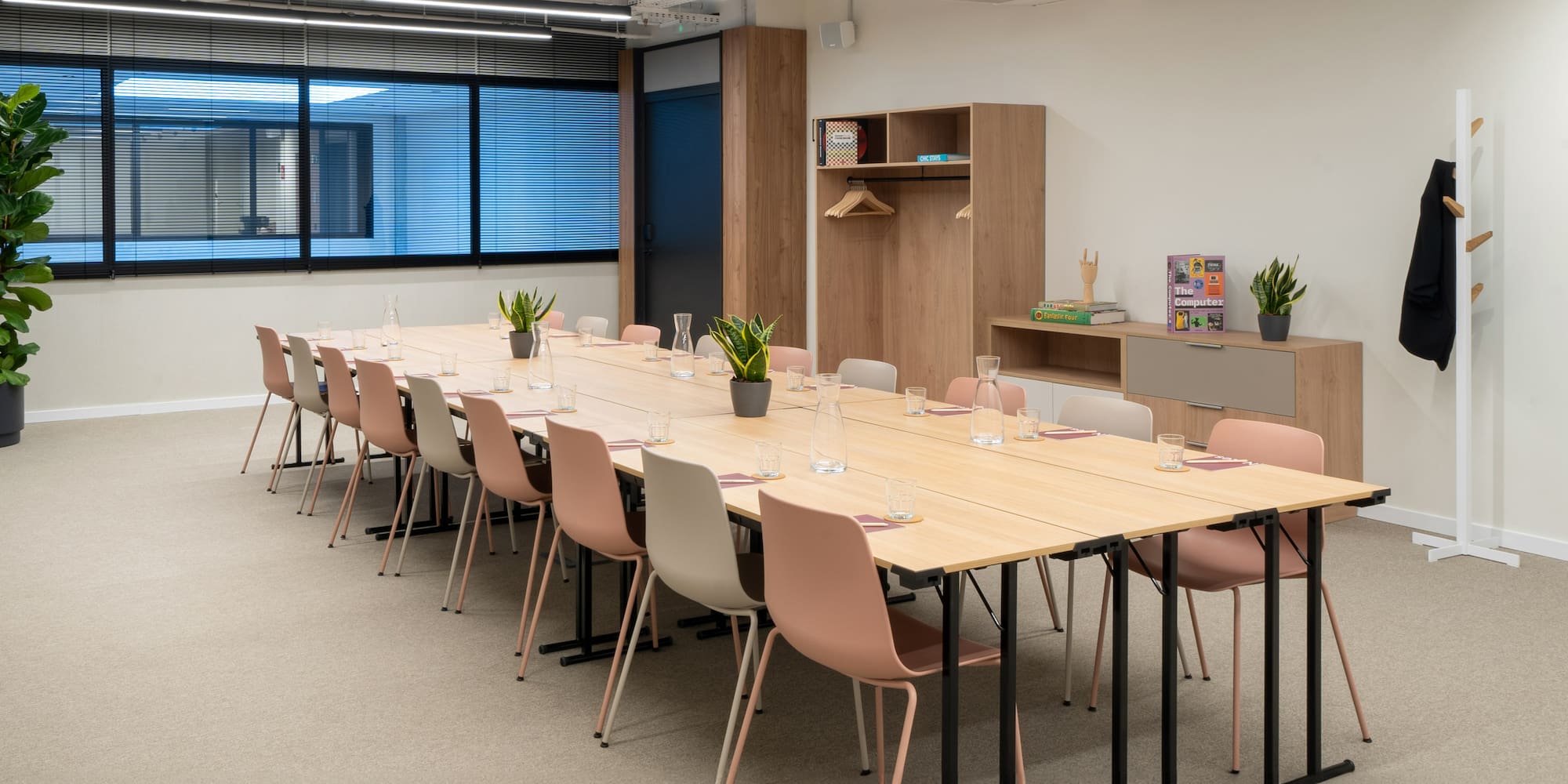 a long table with chairs in a room