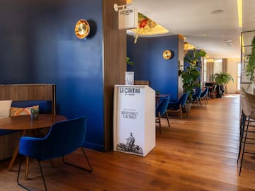 a room with blue walls and a wood floor