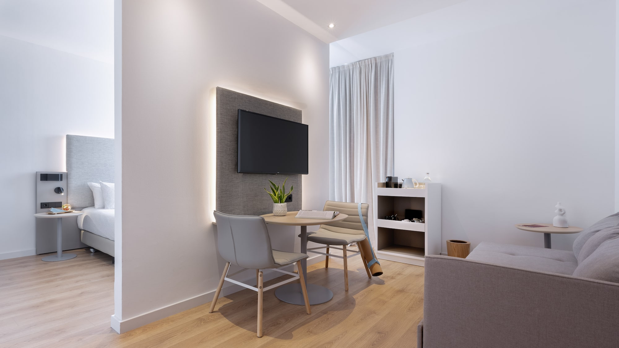 a room with a tv and a table