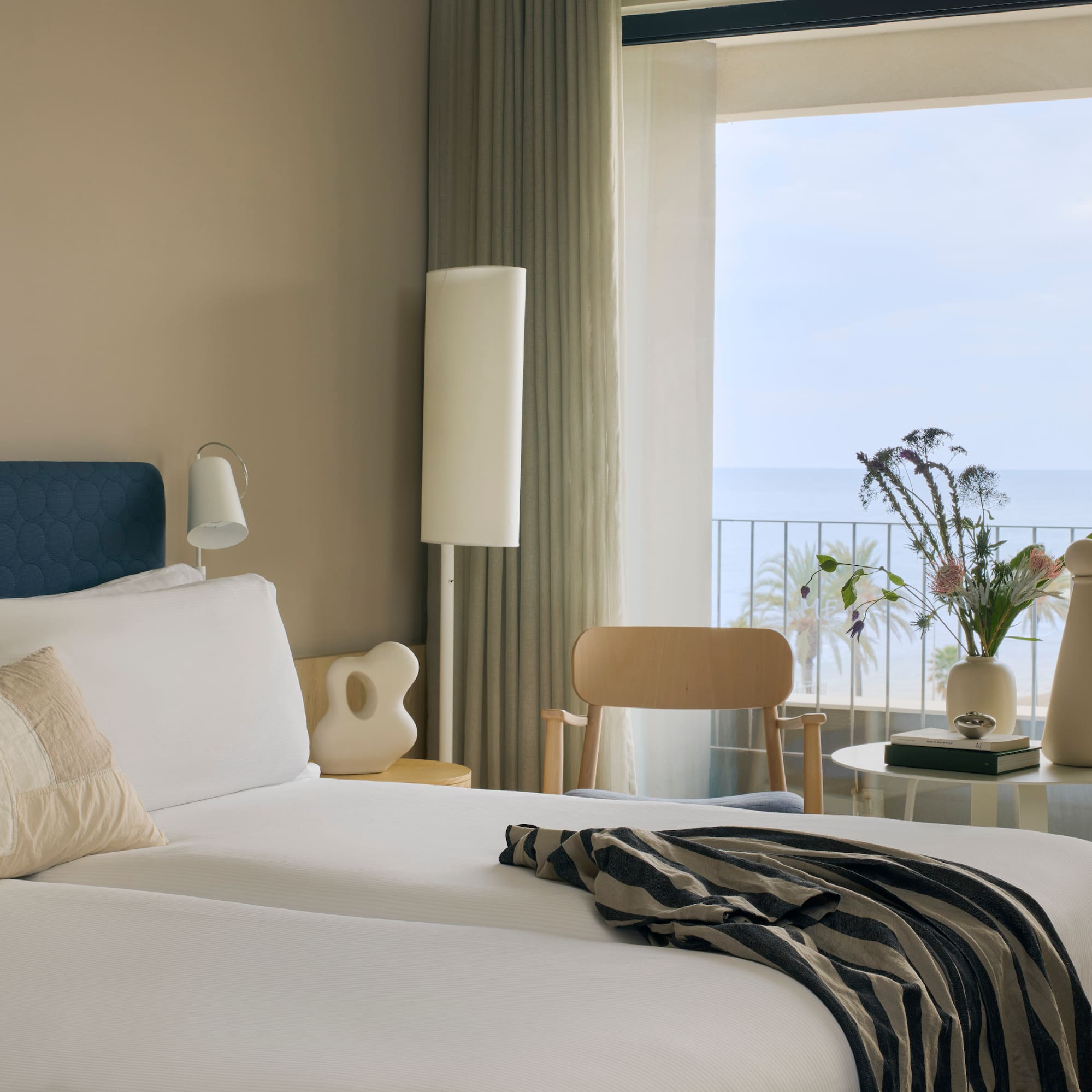 a room with a large window overlooking the ocean