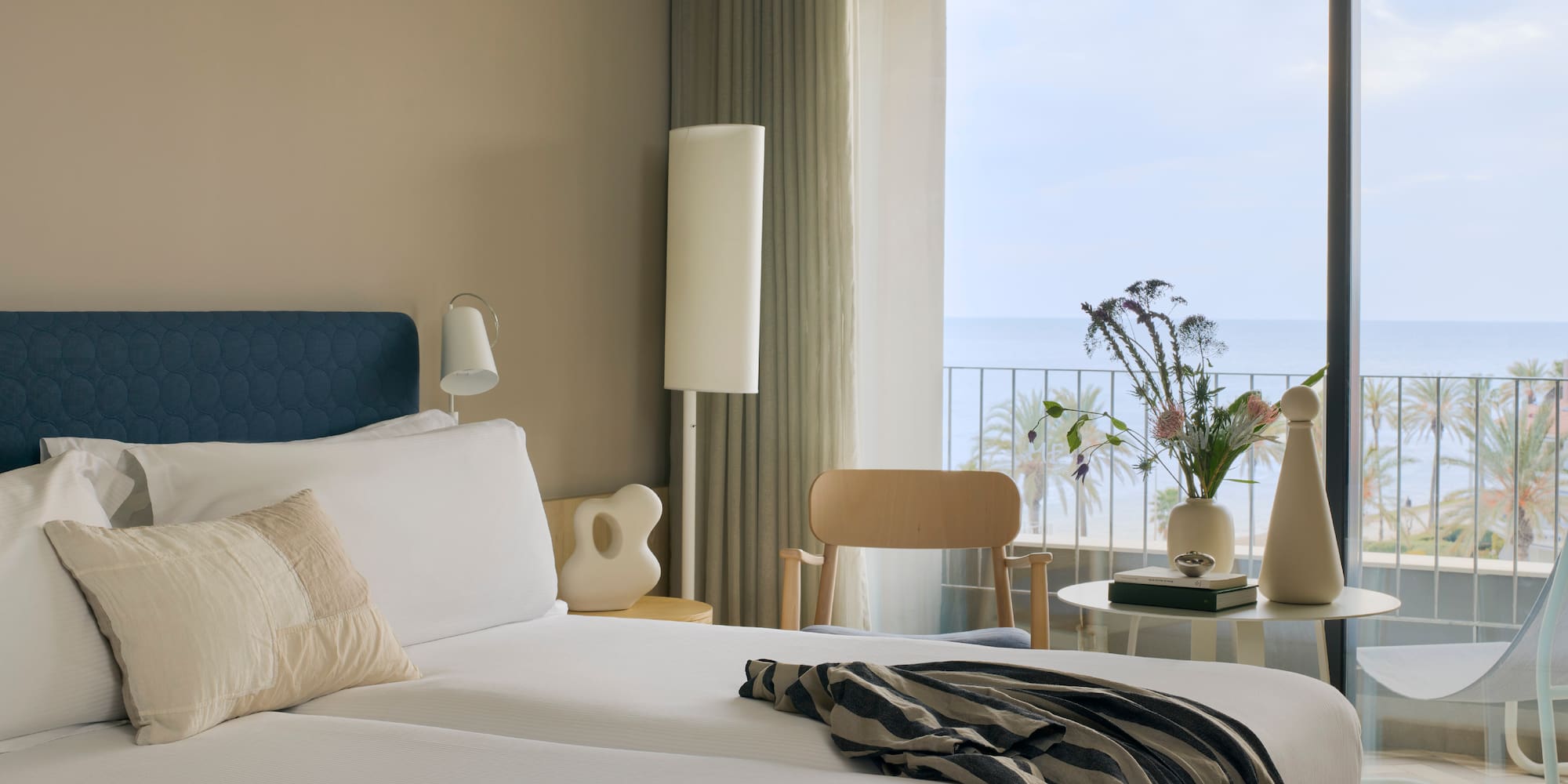 a room with a large window overlooking the ocean