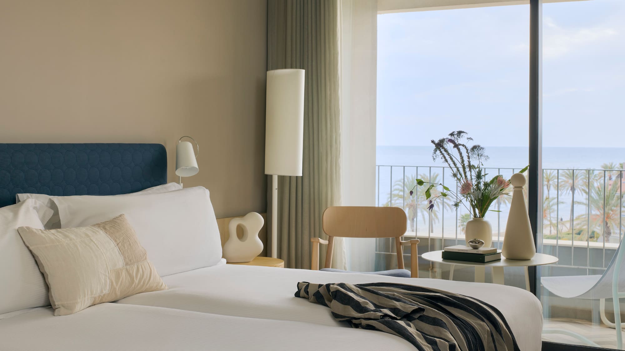 a room with a large window overlooking the ocean