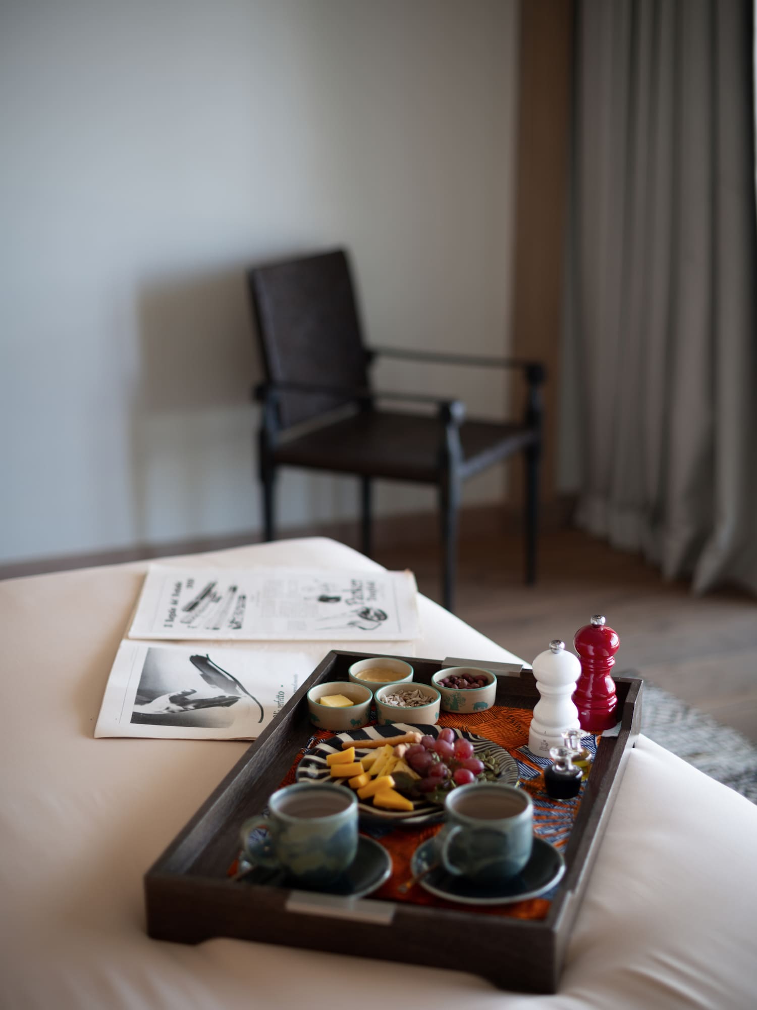 a tray of food on a bed