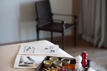 a tray of food on a bed