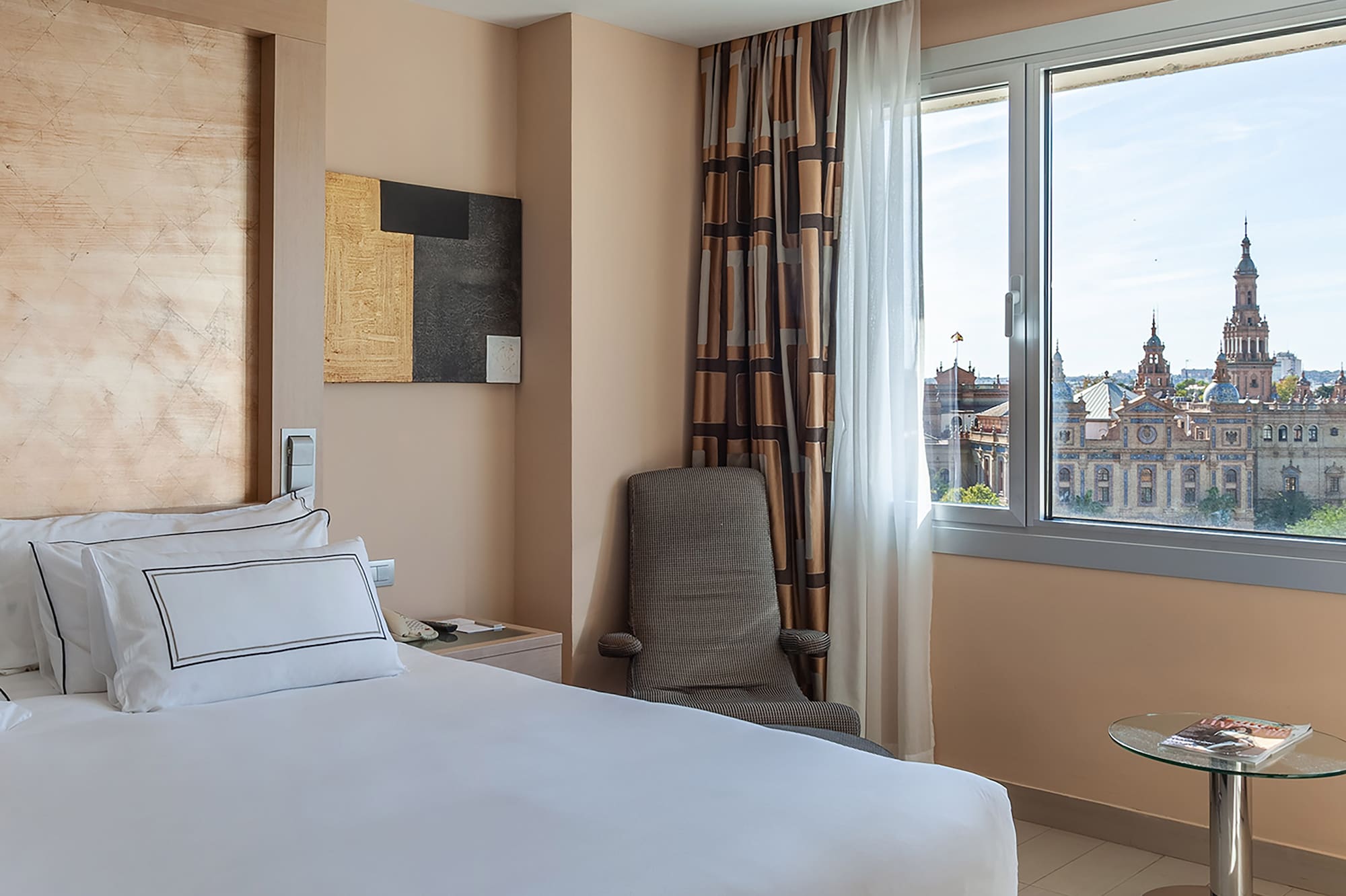 a bedroom with a large bed and a window