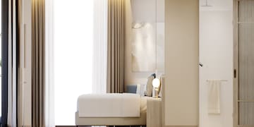 a bed with a lamp next to a window