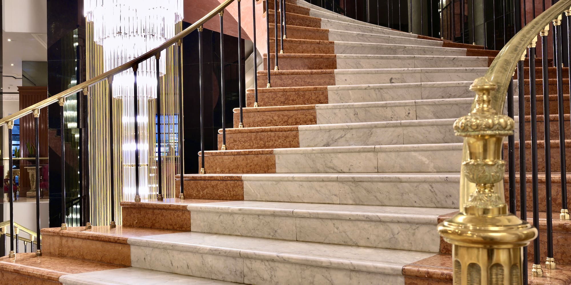 a staircase with a chandelier