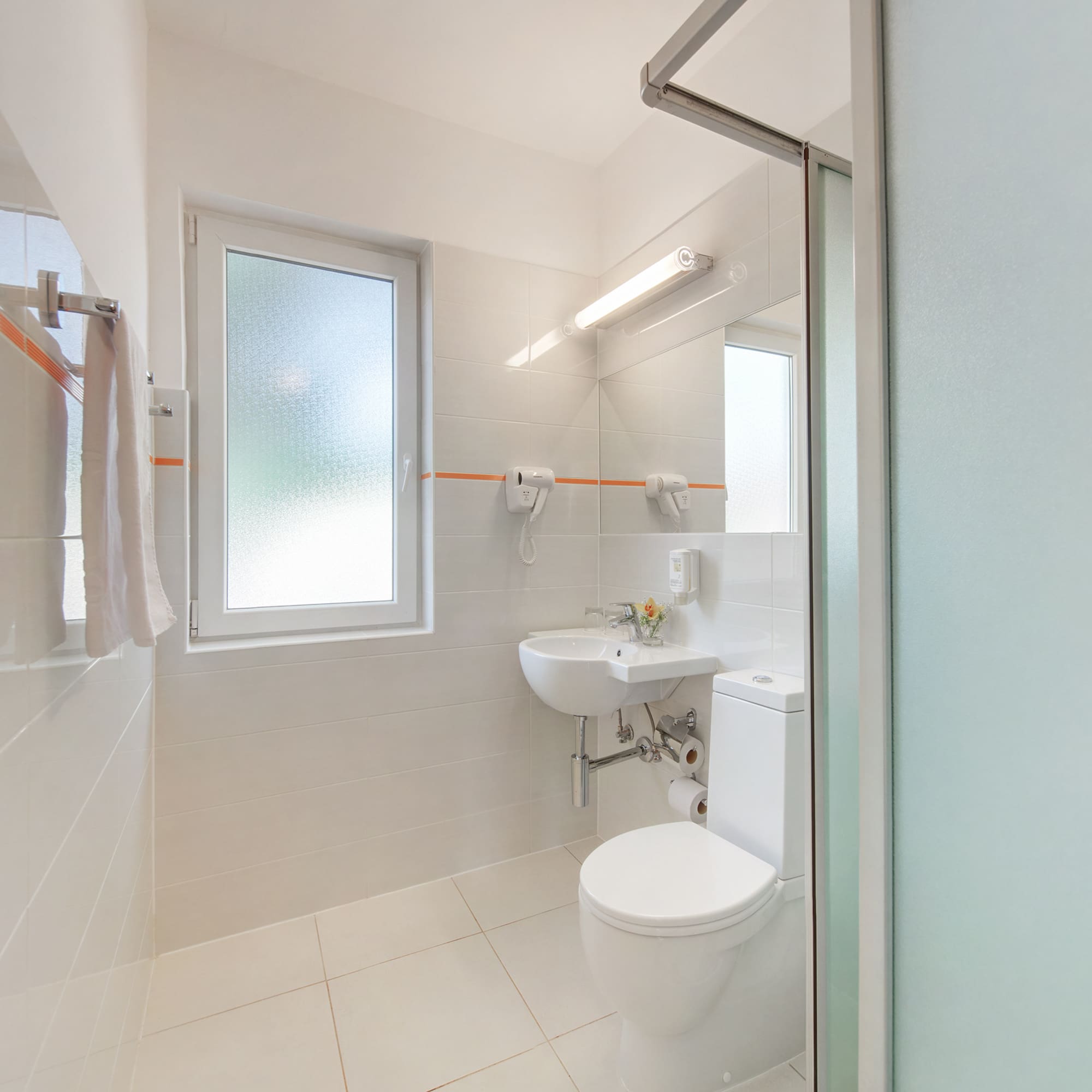 a bathroom with a shower and toilet