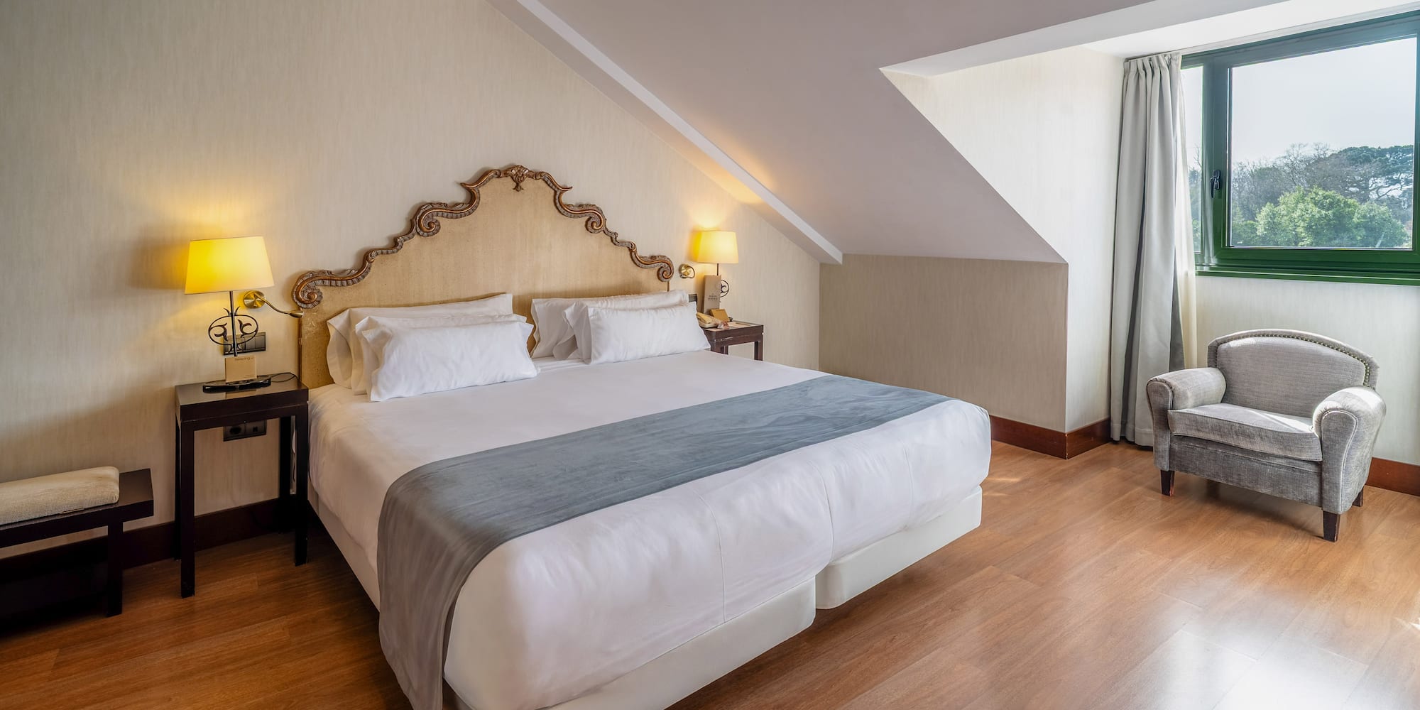 a bedroom with a bed and a chair