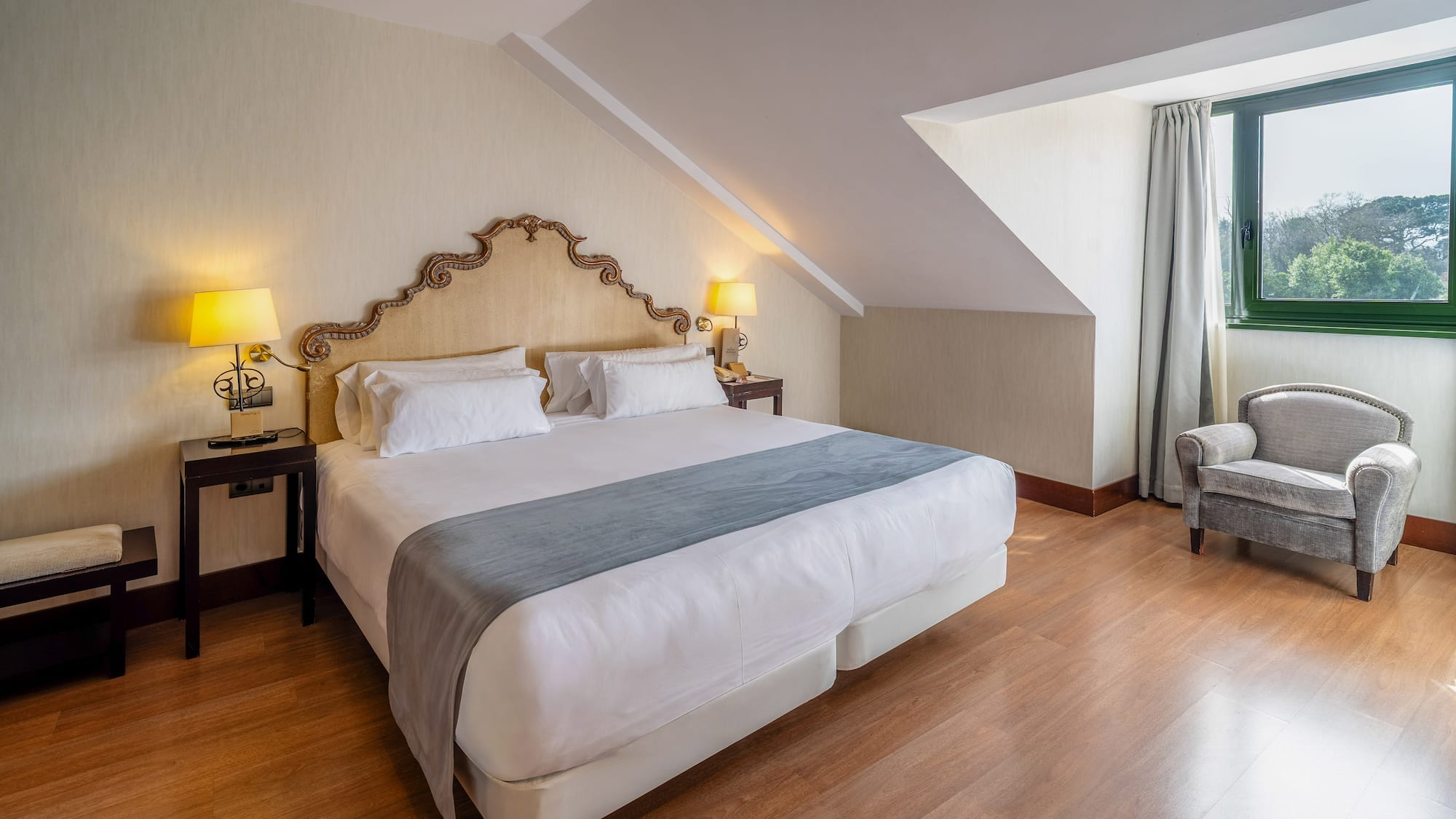 a bedroom with a bed and a chair