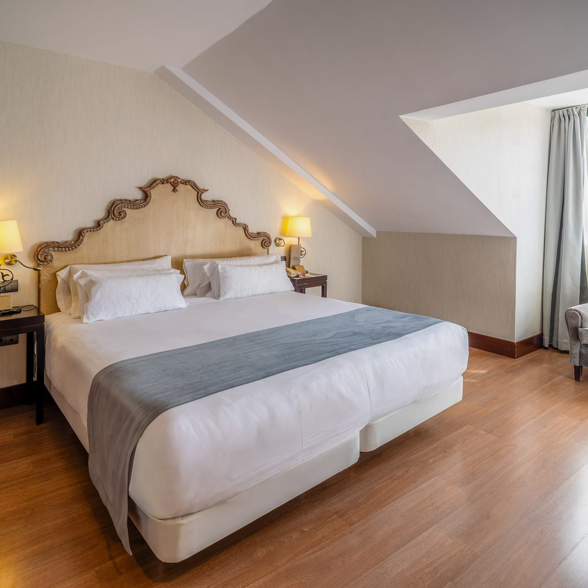 a bedroom with a bed and a chair