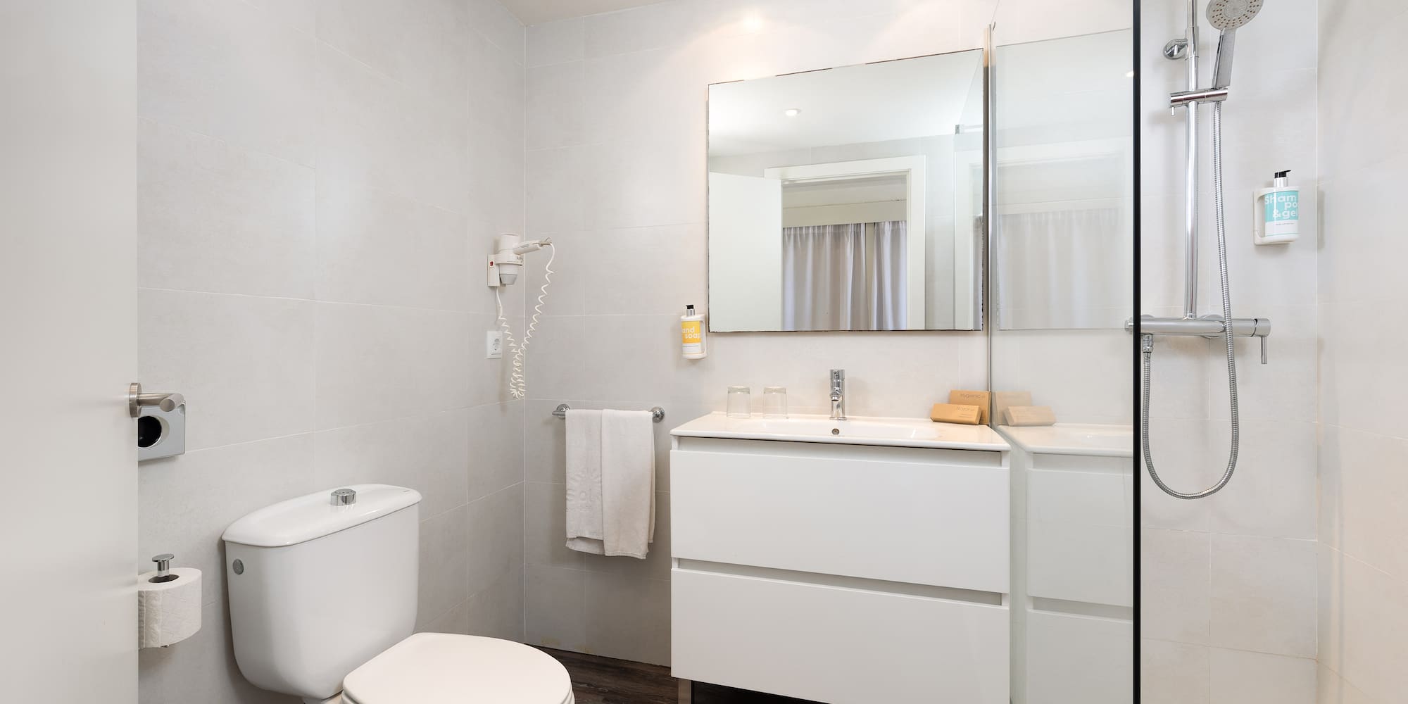 a bathroom with a mirror and sink