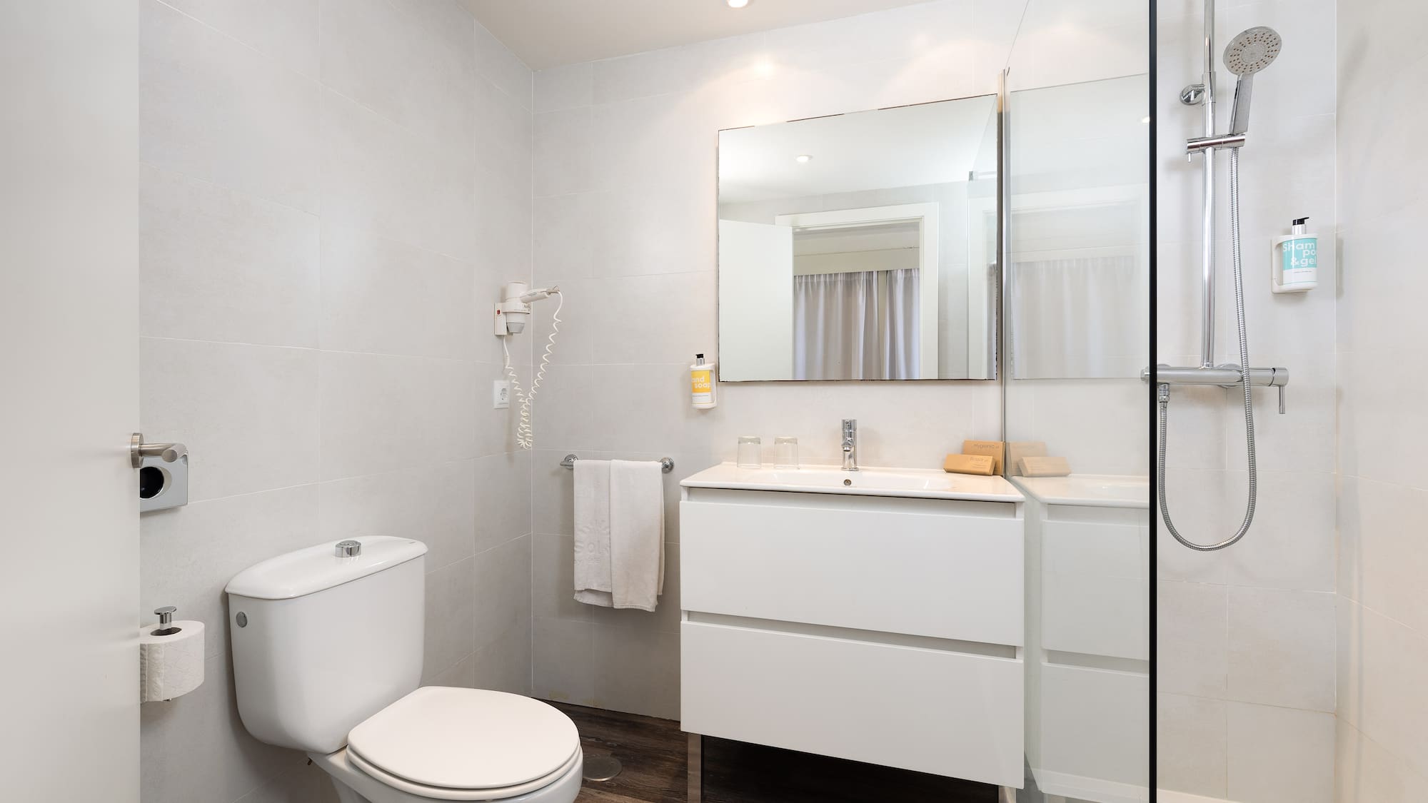 a bathroom with a mirror and sink