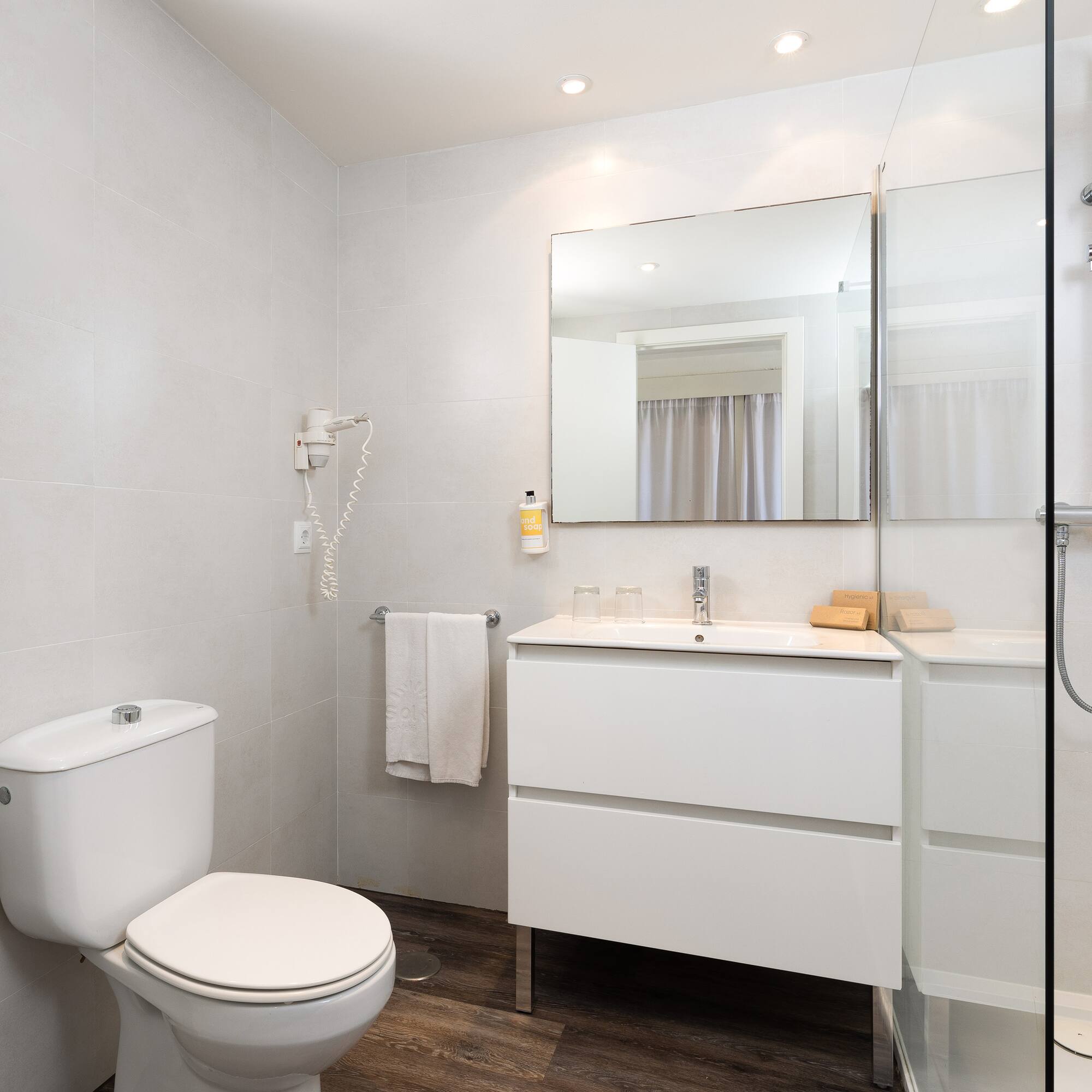 a bathroom with a mirror and sink