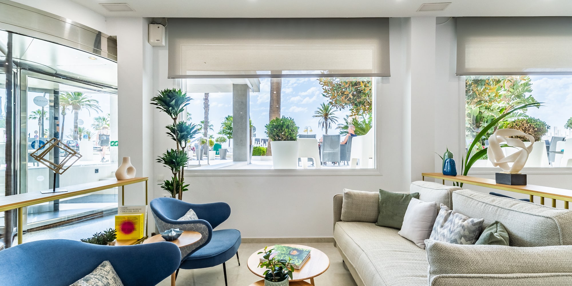 a room with a couch and chairs