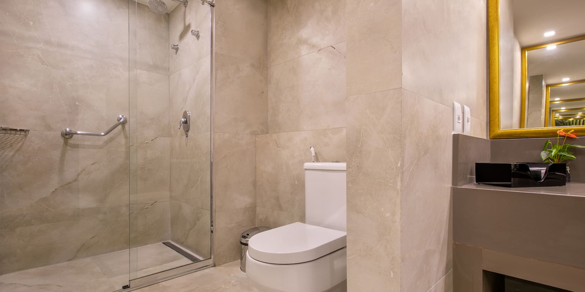 a bathroom with a glass shower door