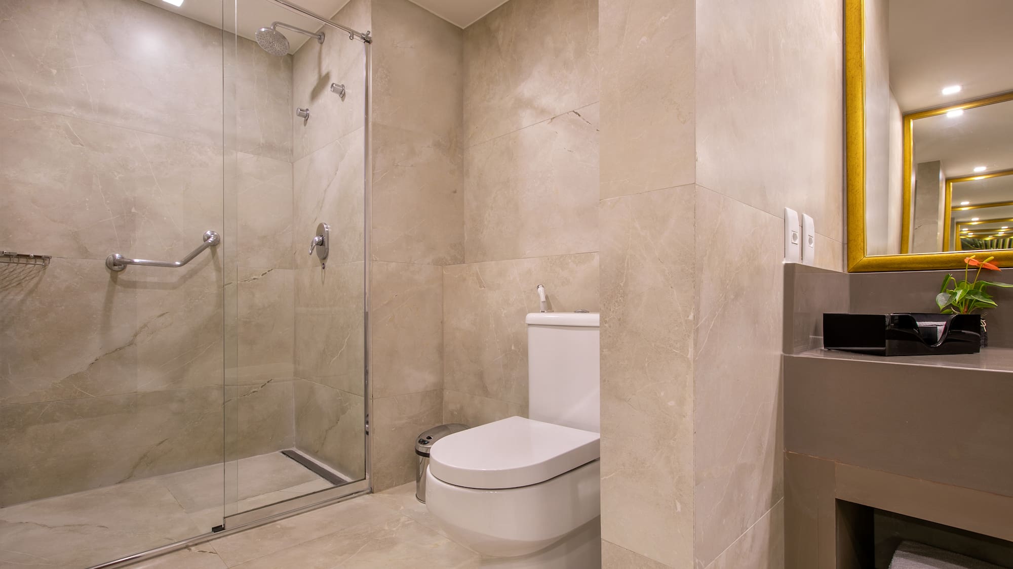 a bathroom with a glass shower door