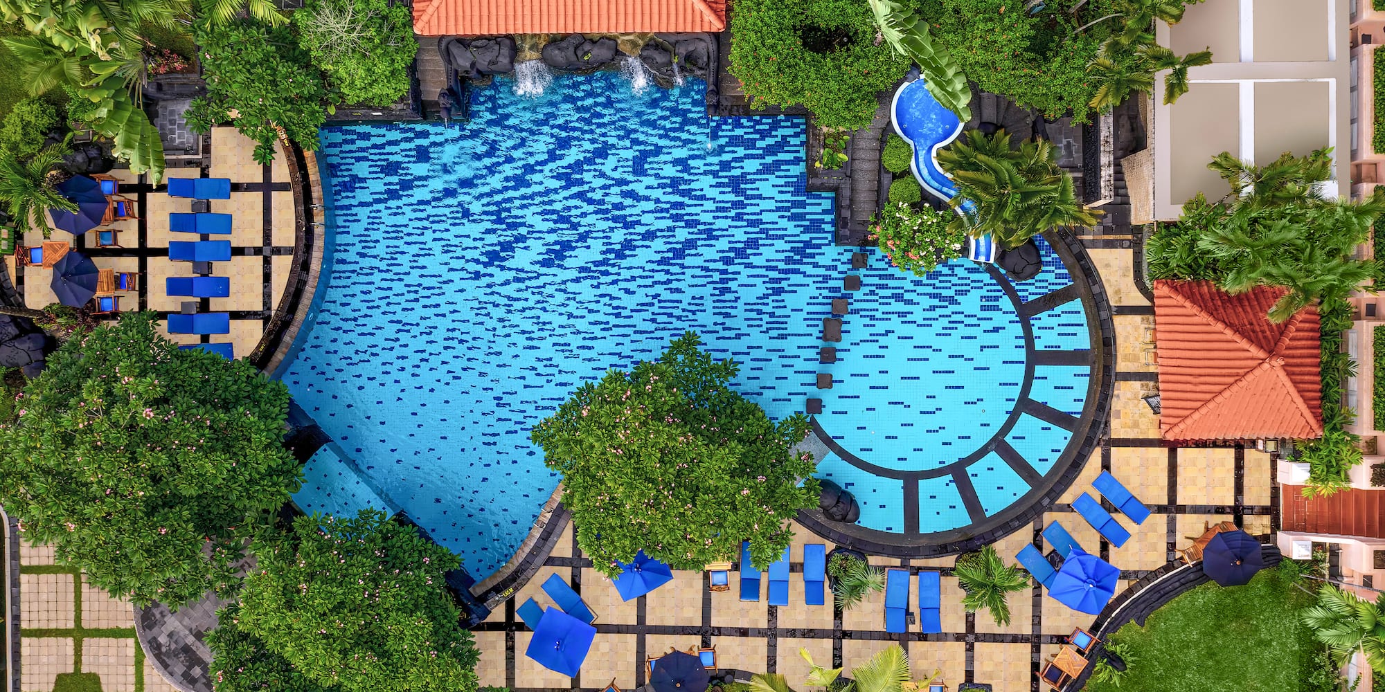 a swimming pool with trees and a pool