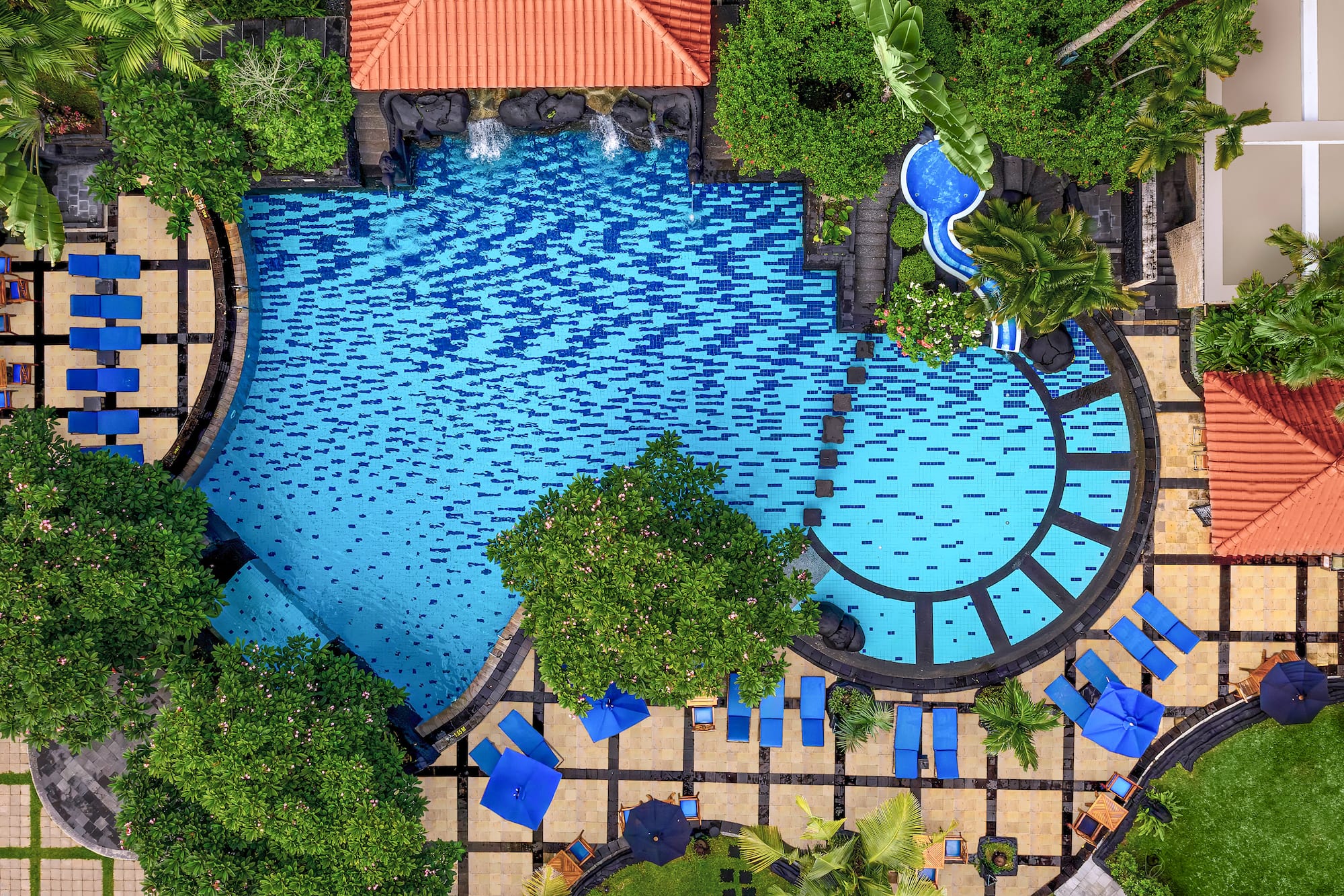 a swimming pool with trees and a pool