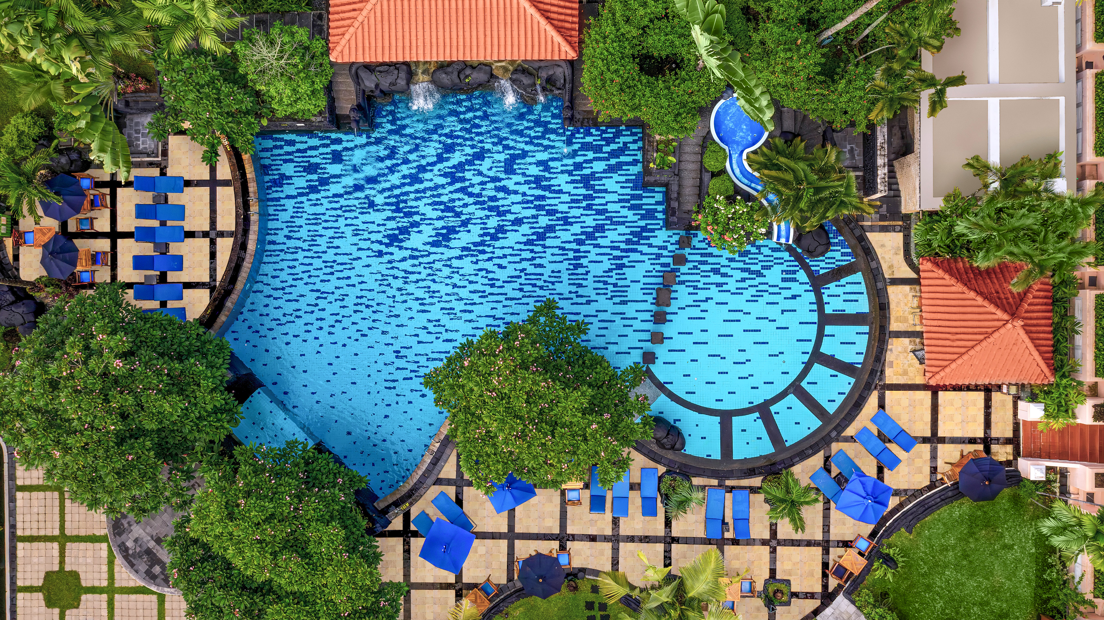 a swimming pool with trees and a pool