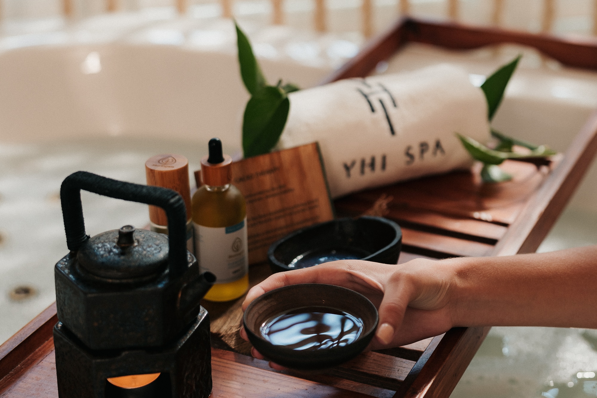 a person holding a bowl of water