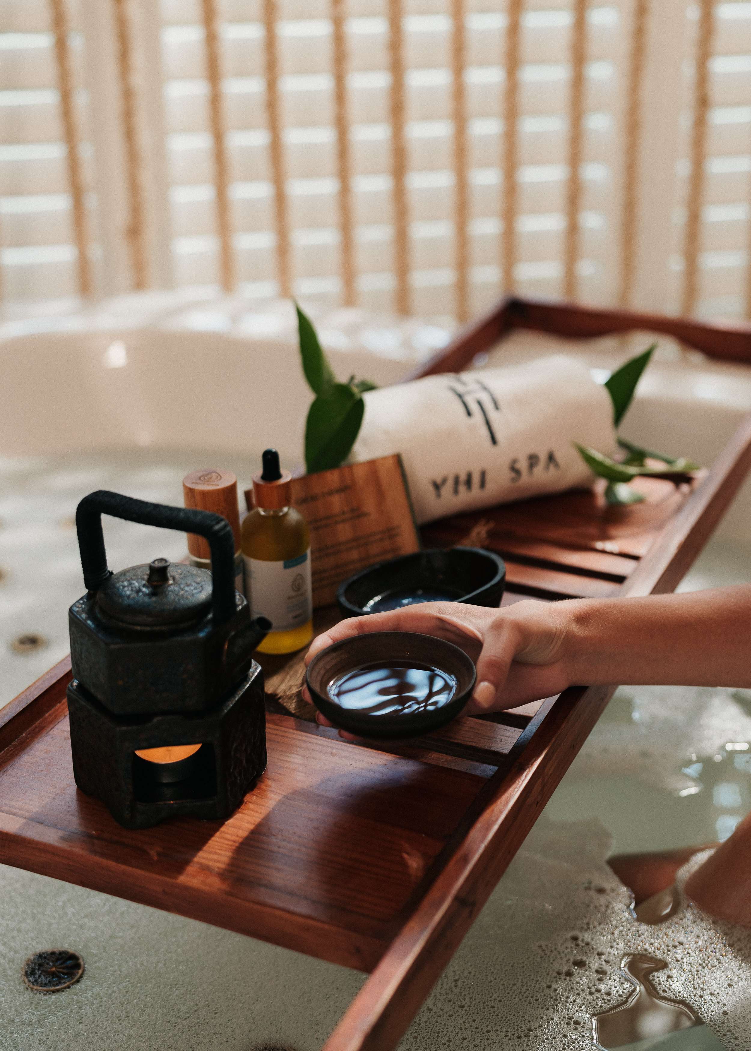 a person holding a bowl of water