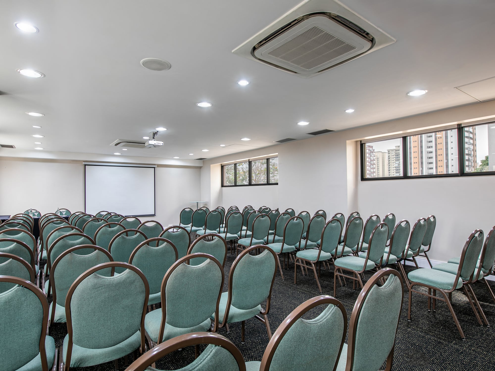 a room with rows of chairs