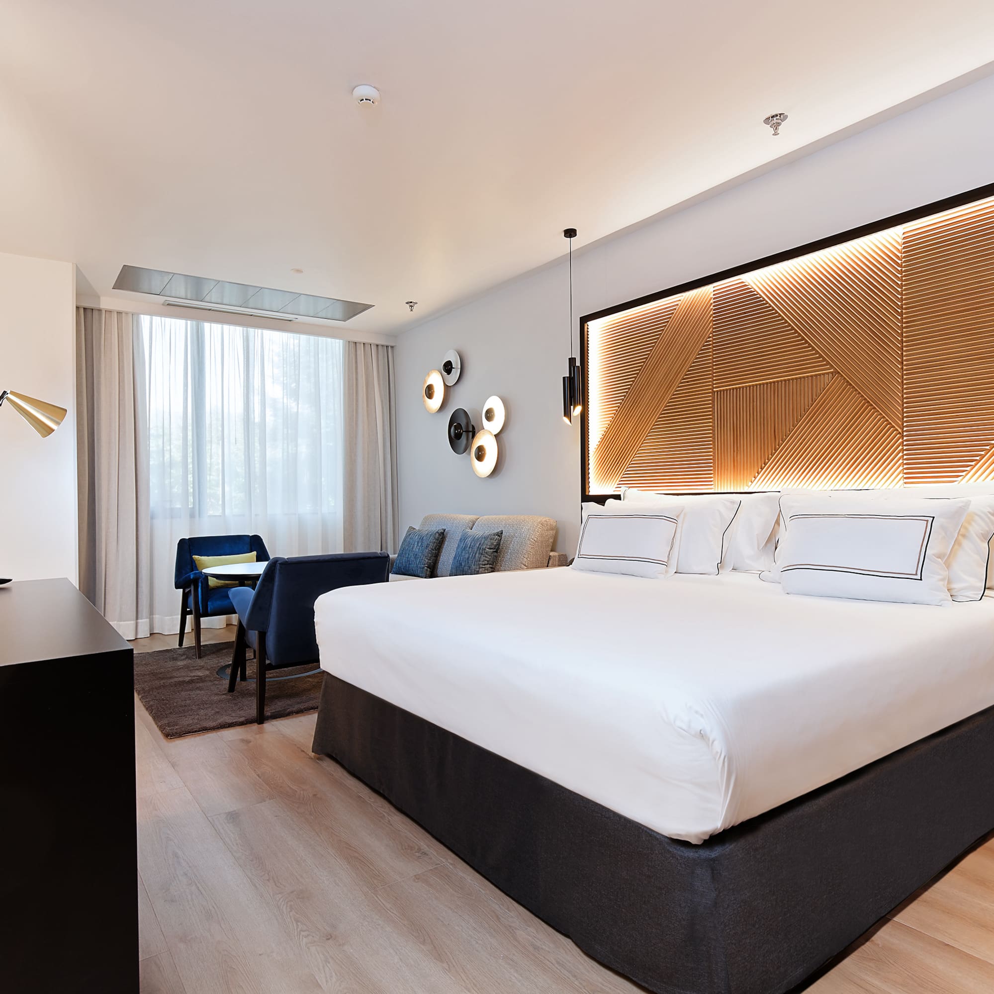 a room with a bed and a desk