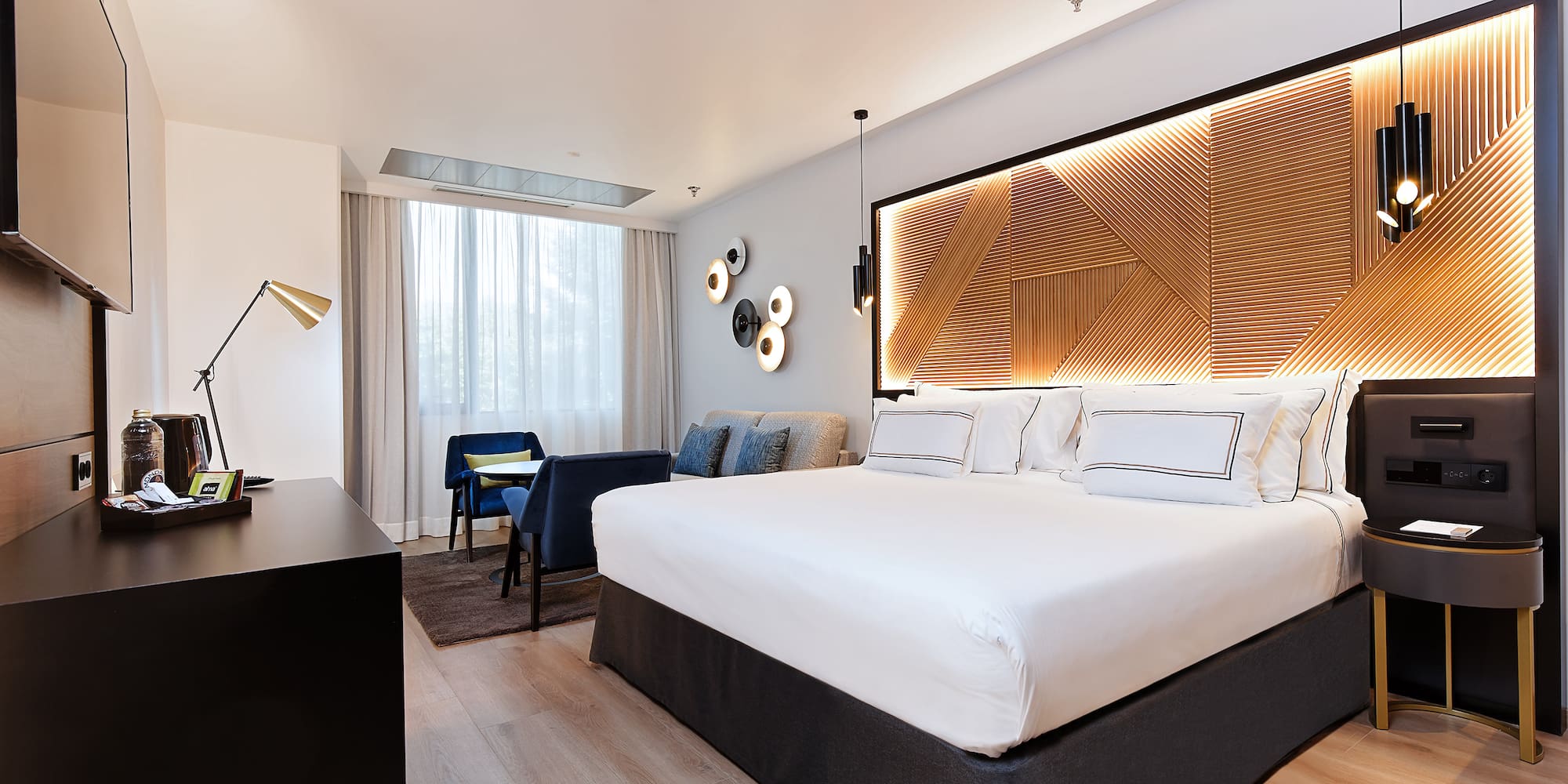 a room with a bed and a desk