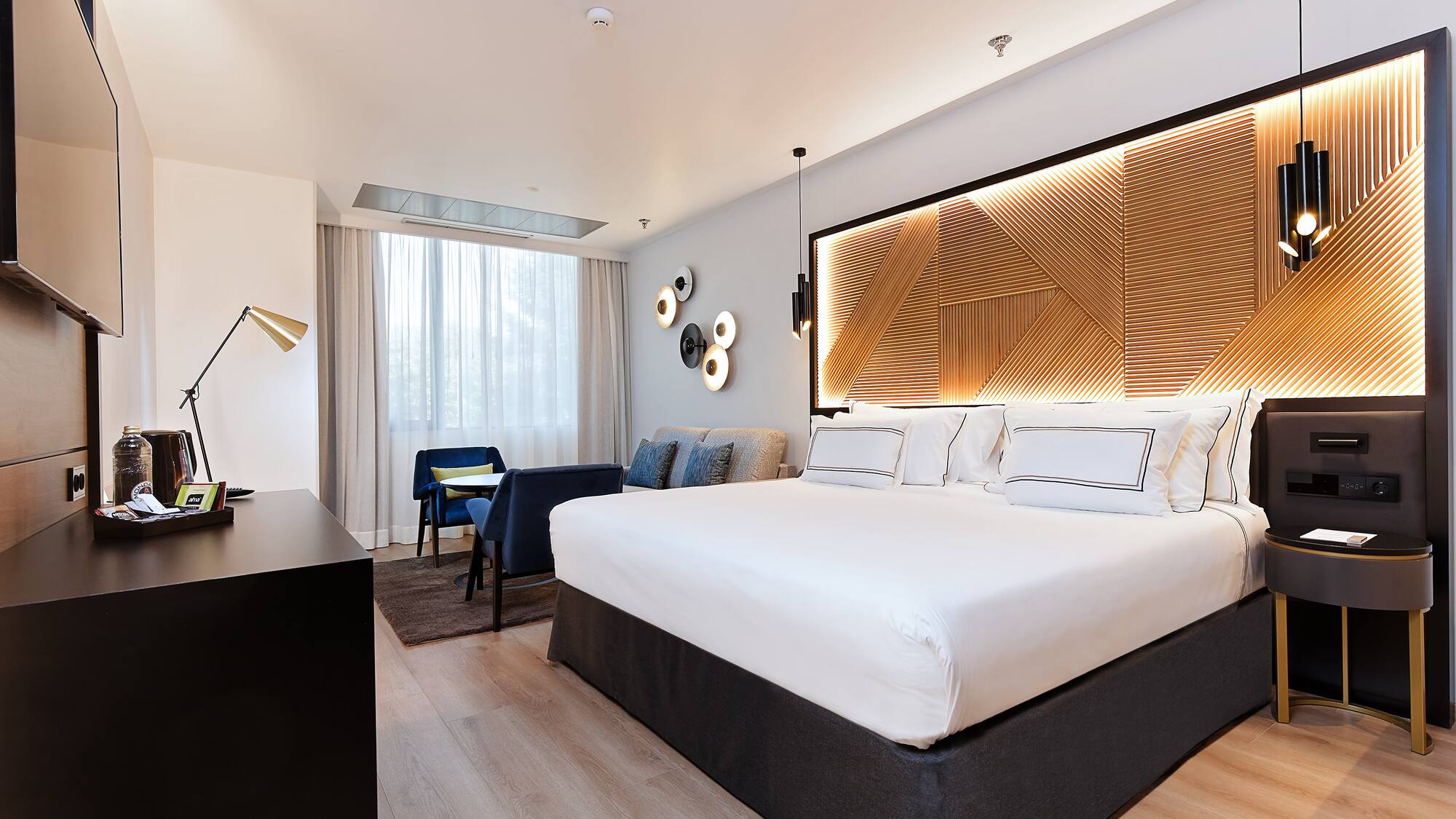 a room with a bed and a desk