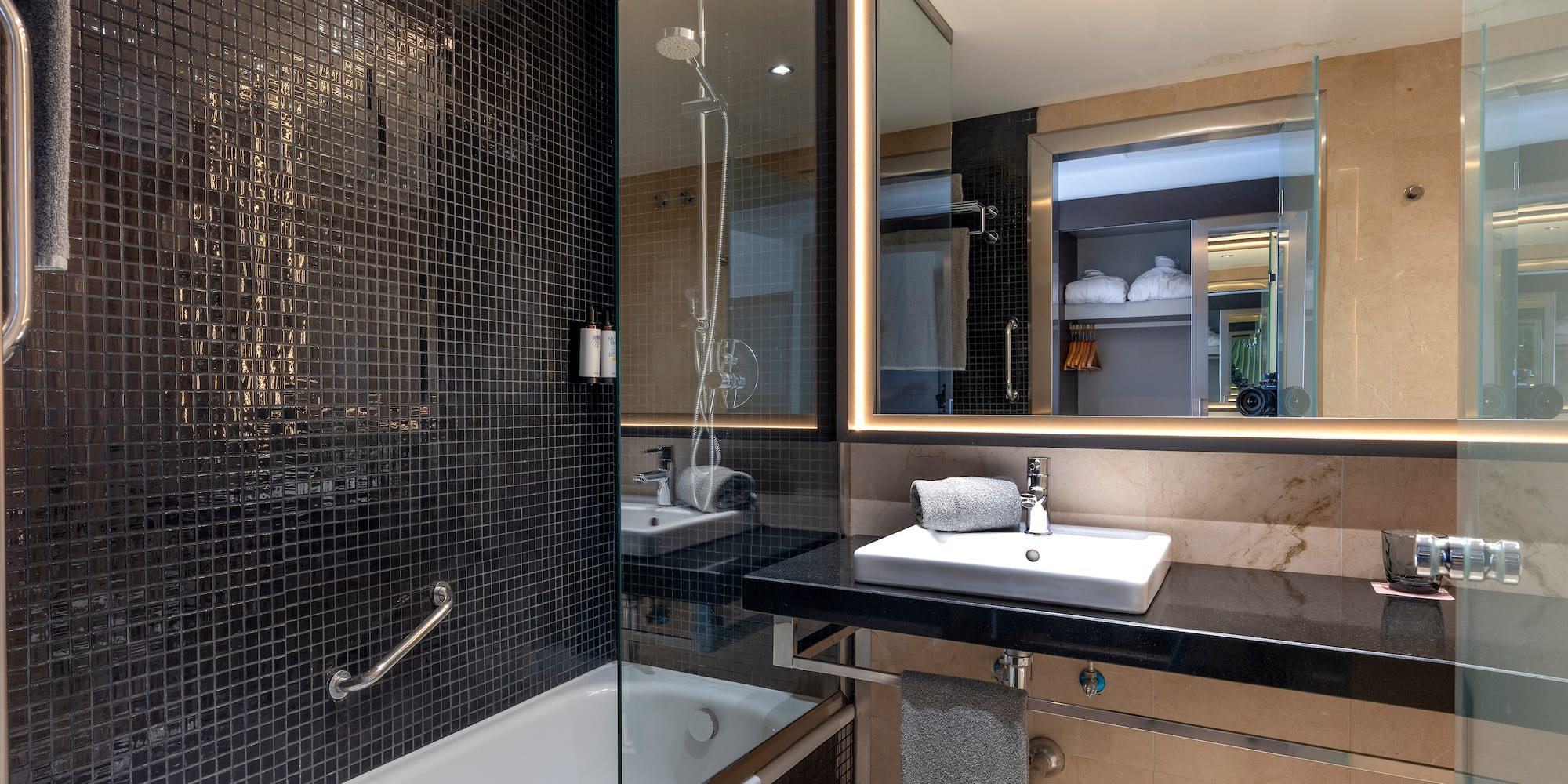 a bathroom with a sink and a shower