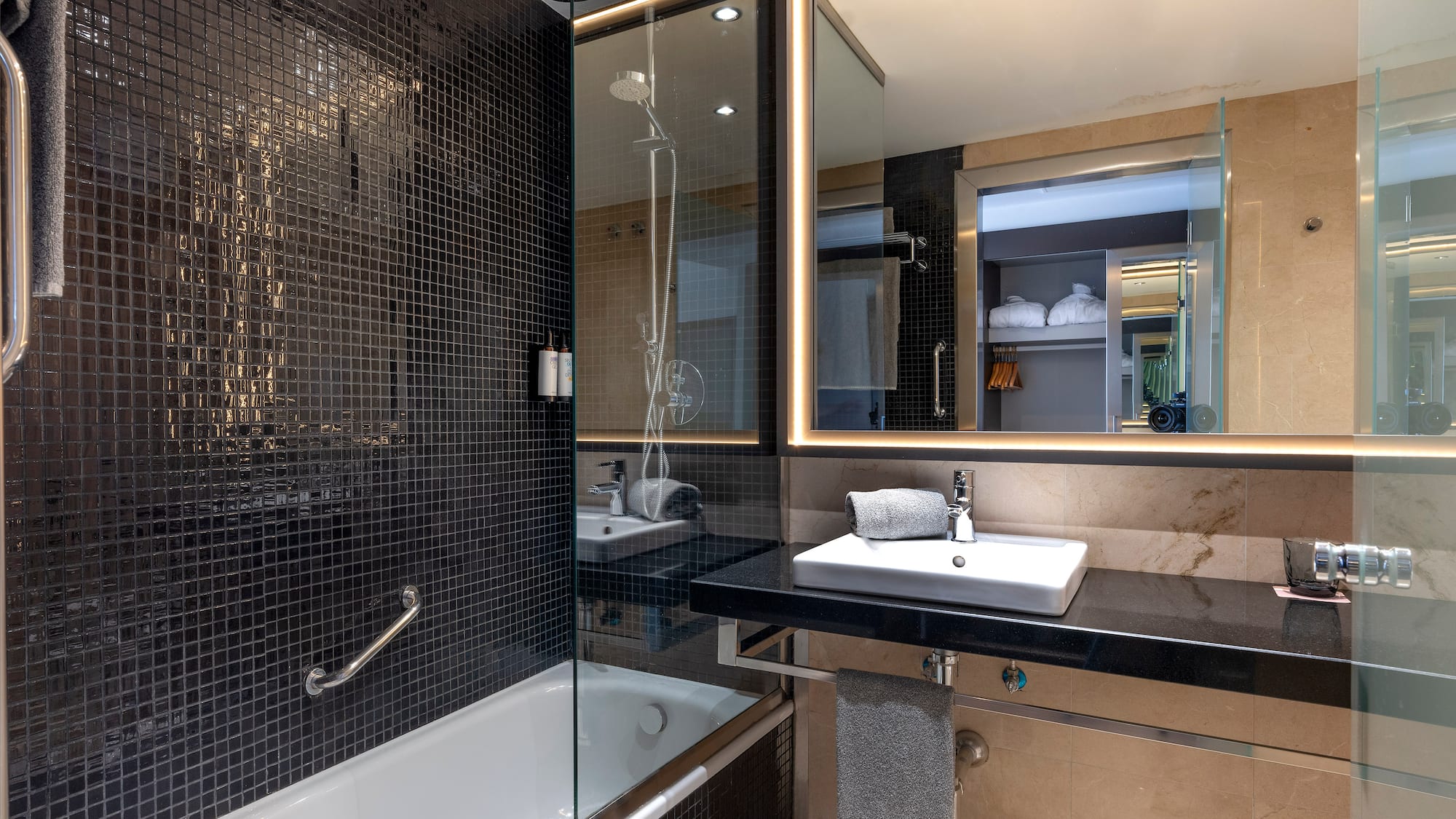 a bathroom with a sink and a shower