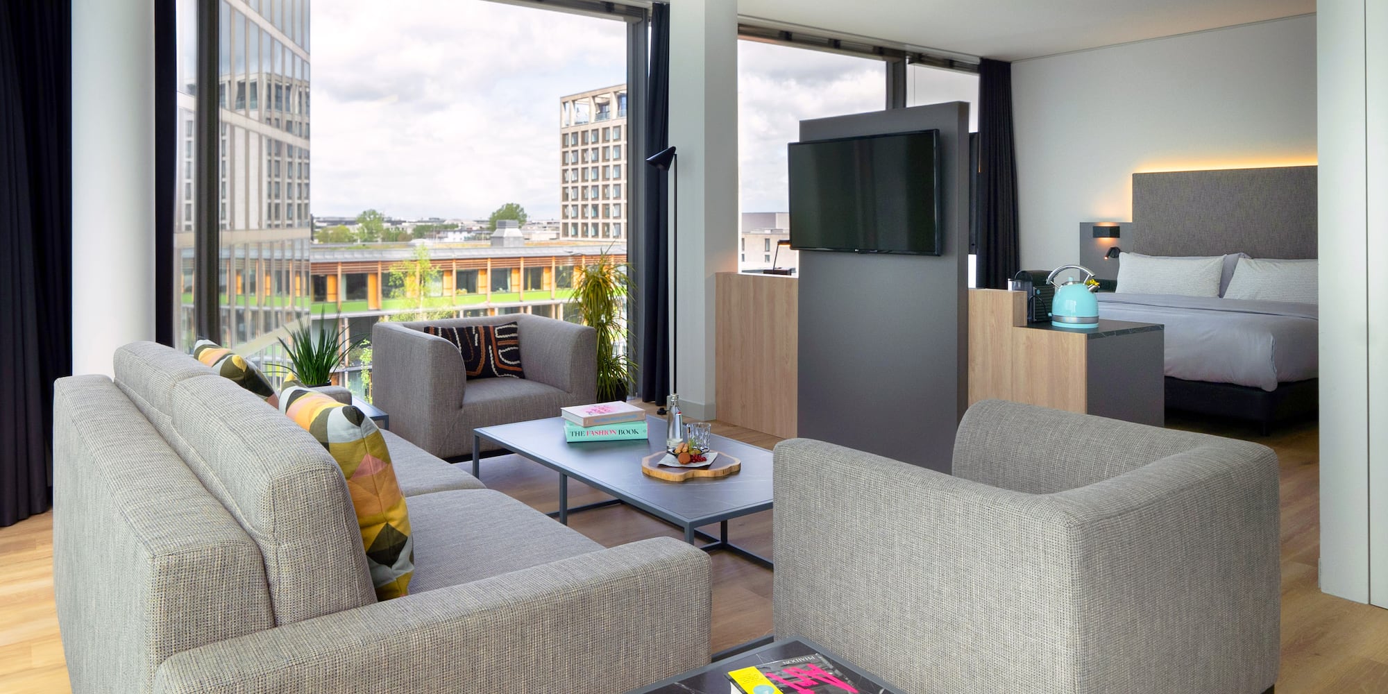 a living room with a television and couches